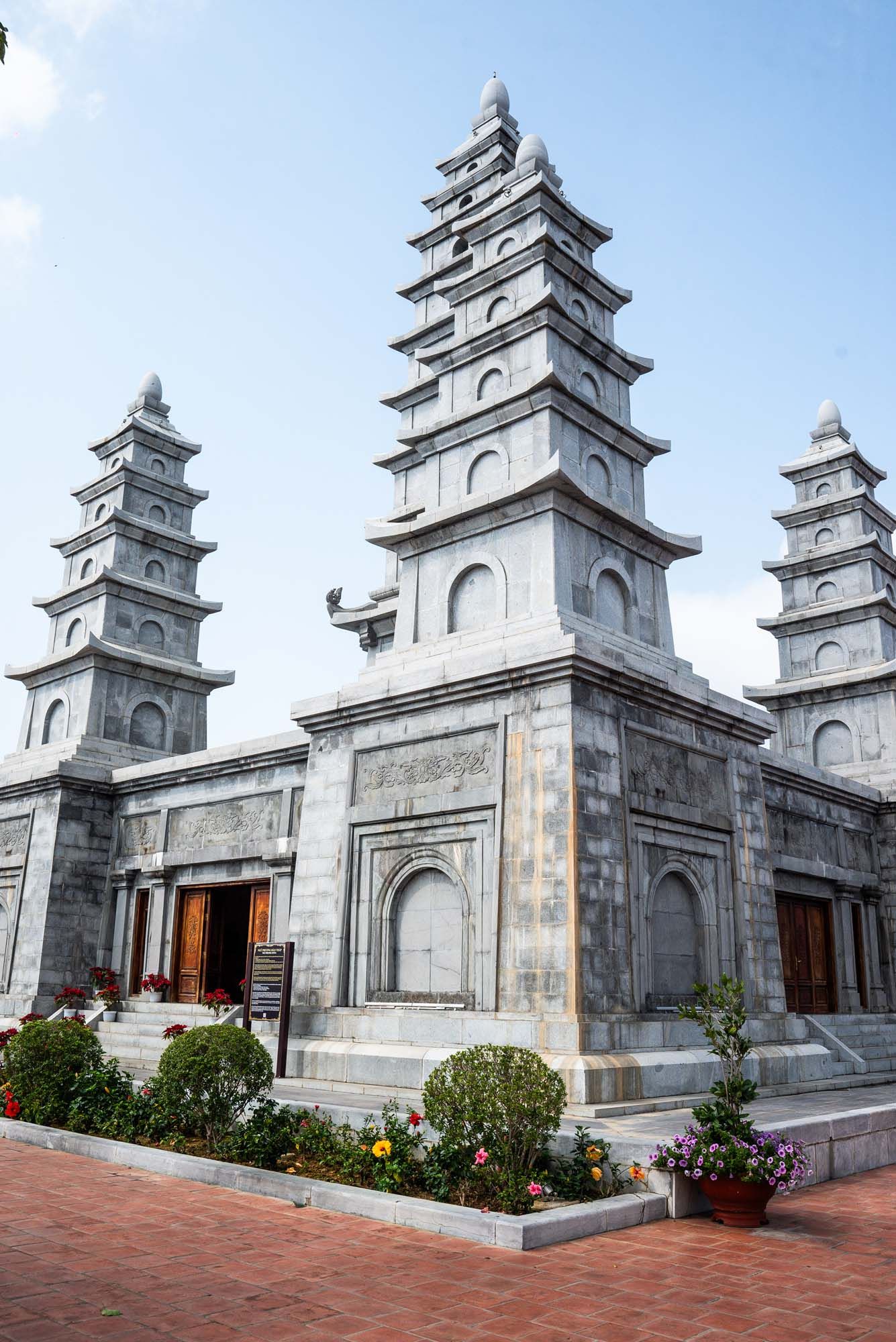 A sequence of traditional Vietnamese Buddhist pagoda towers with tiered roofs and ornate architectural details at Linh Ung Pagoda.