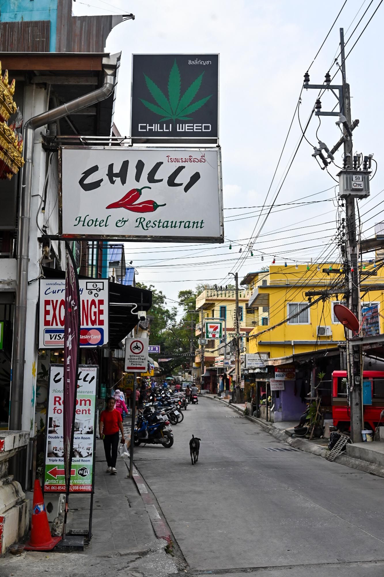 A series of street views in Thailand showing urban roads with shops, signs, power lines and parked motorcycles along the way.