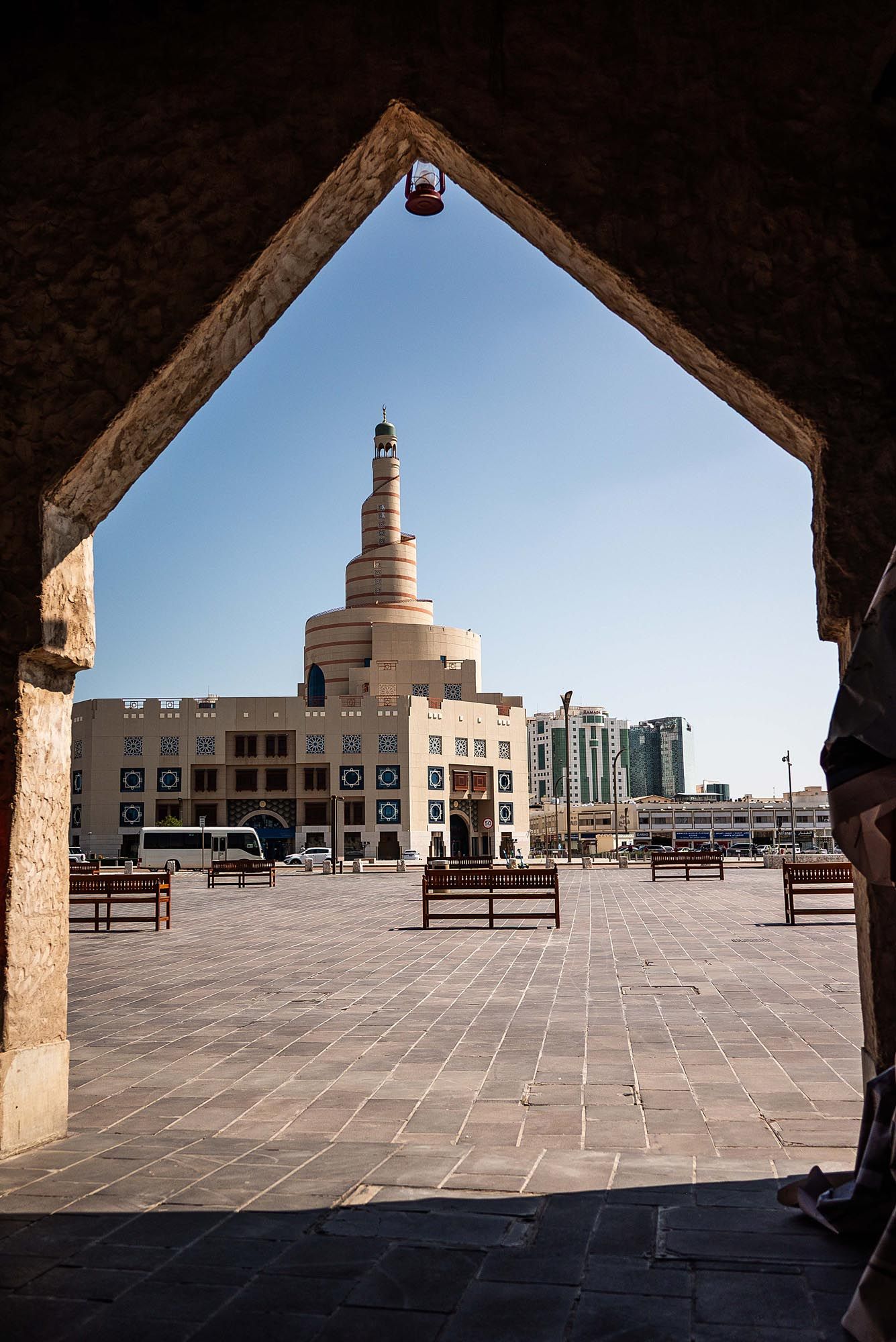 Three panoramic views of the iconic spiral minaret at the Qatari Islamic Cultural Center in Doha, Qatar.