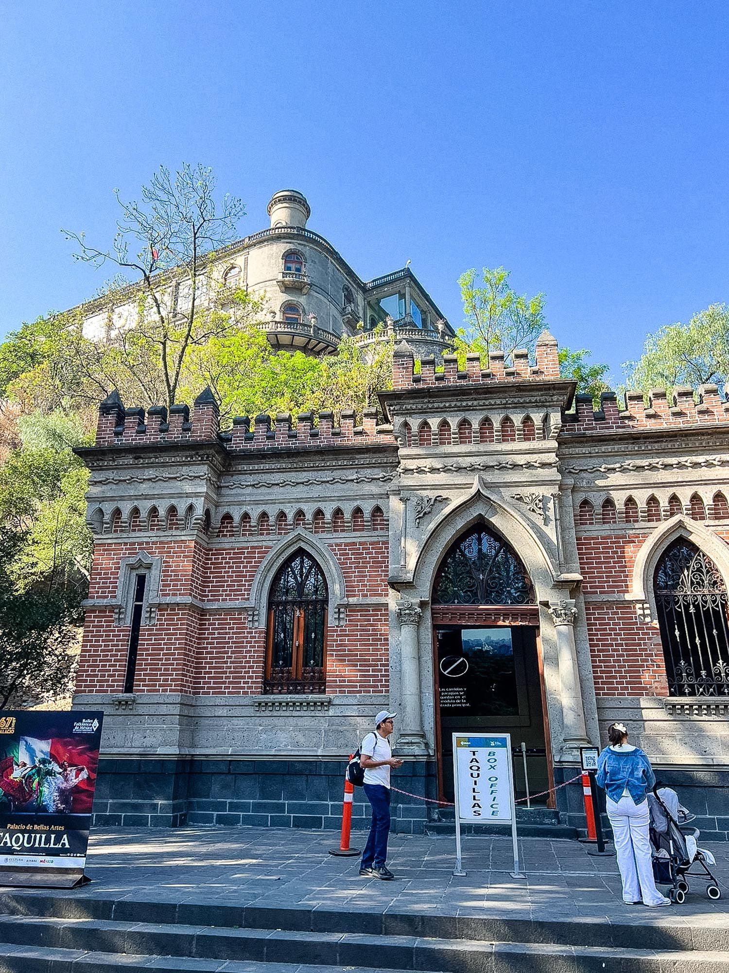 Historic brick archway entrance with decorative stonework and metal gates at different angles and lighting conditions.