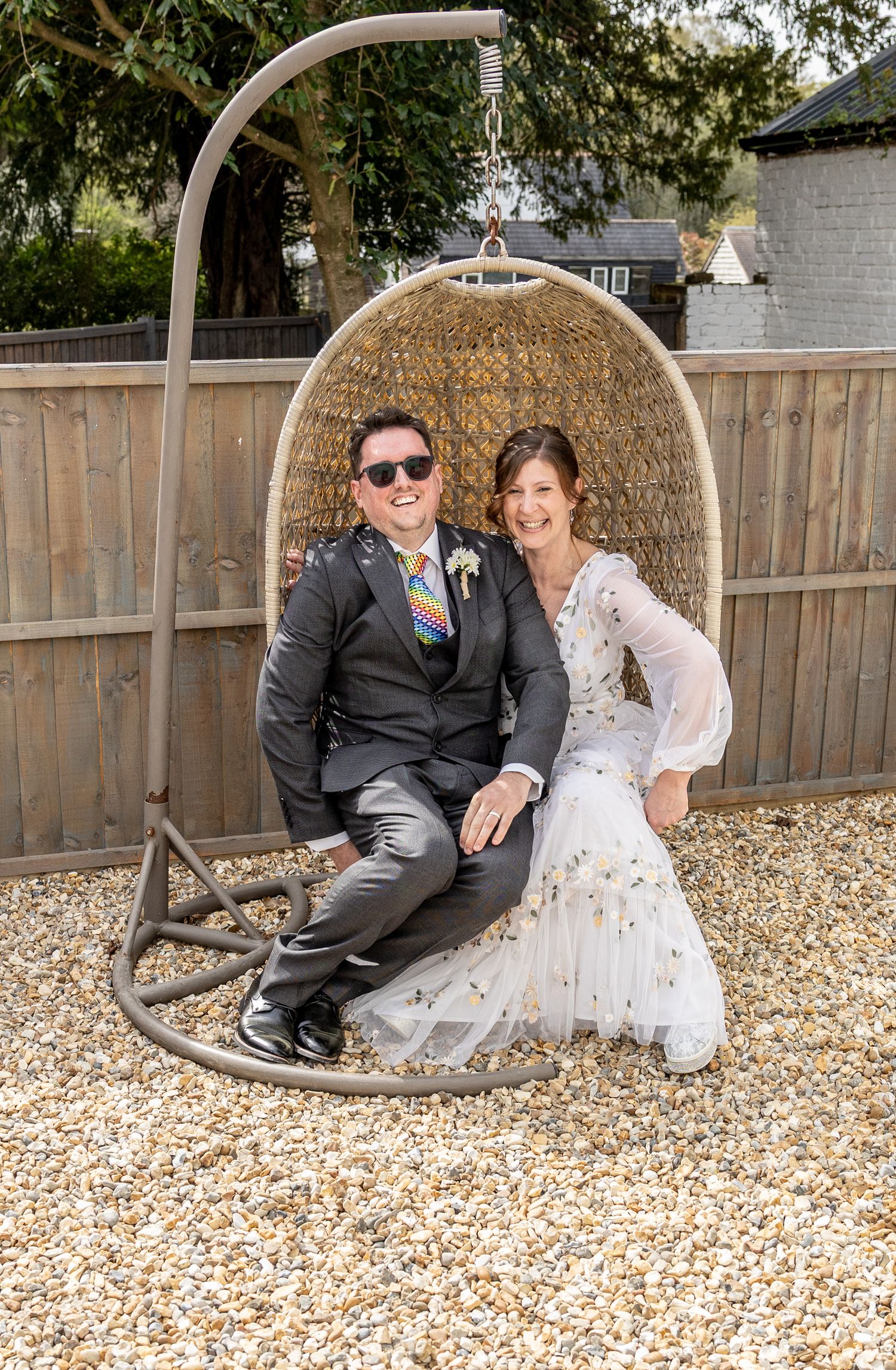 A sequence of romantic photos showing a couple sitting together in an outdoor hanging egg chair.