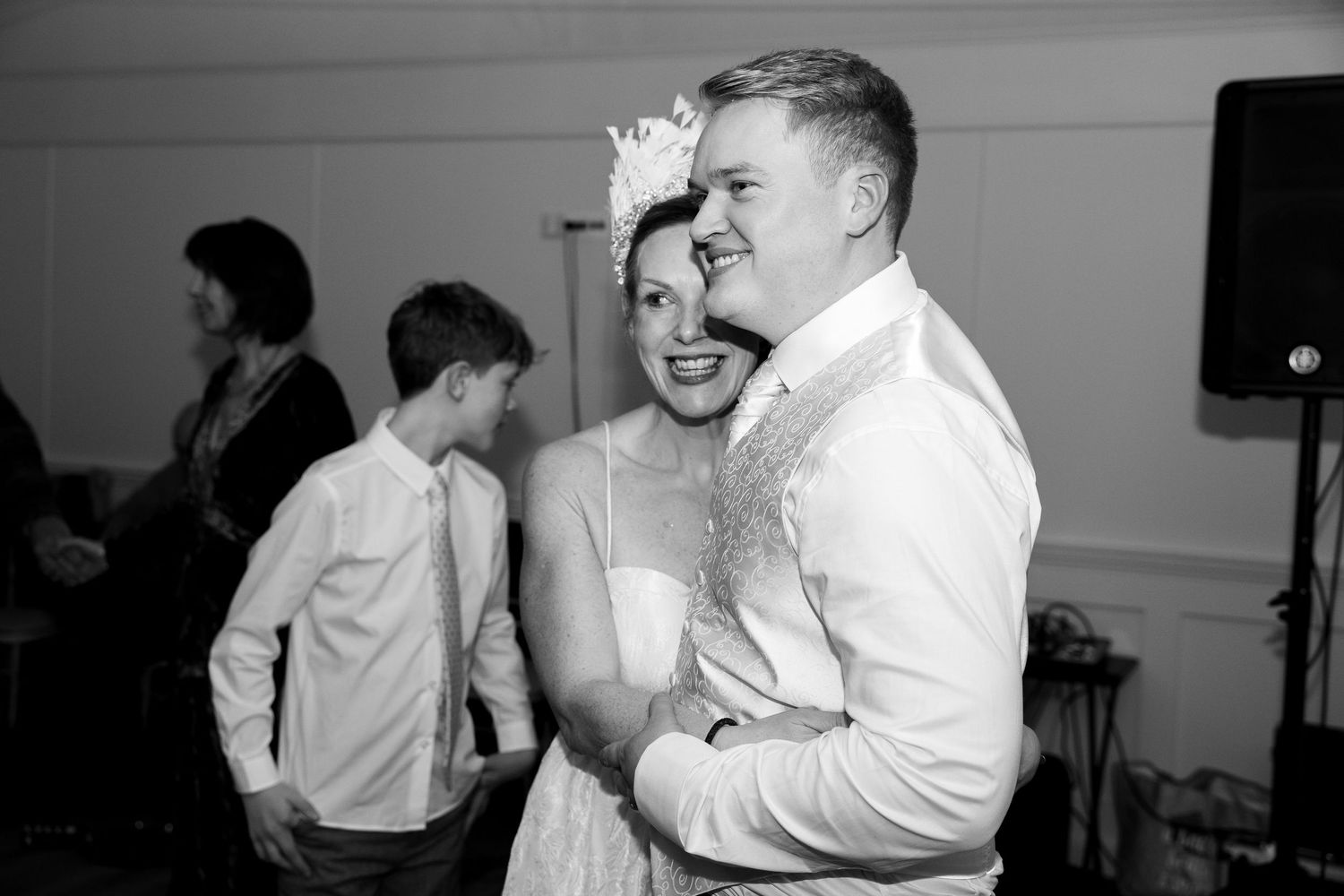 Black and white photo collage showing multiple couples dancing together in what appears to be a dance class setting.