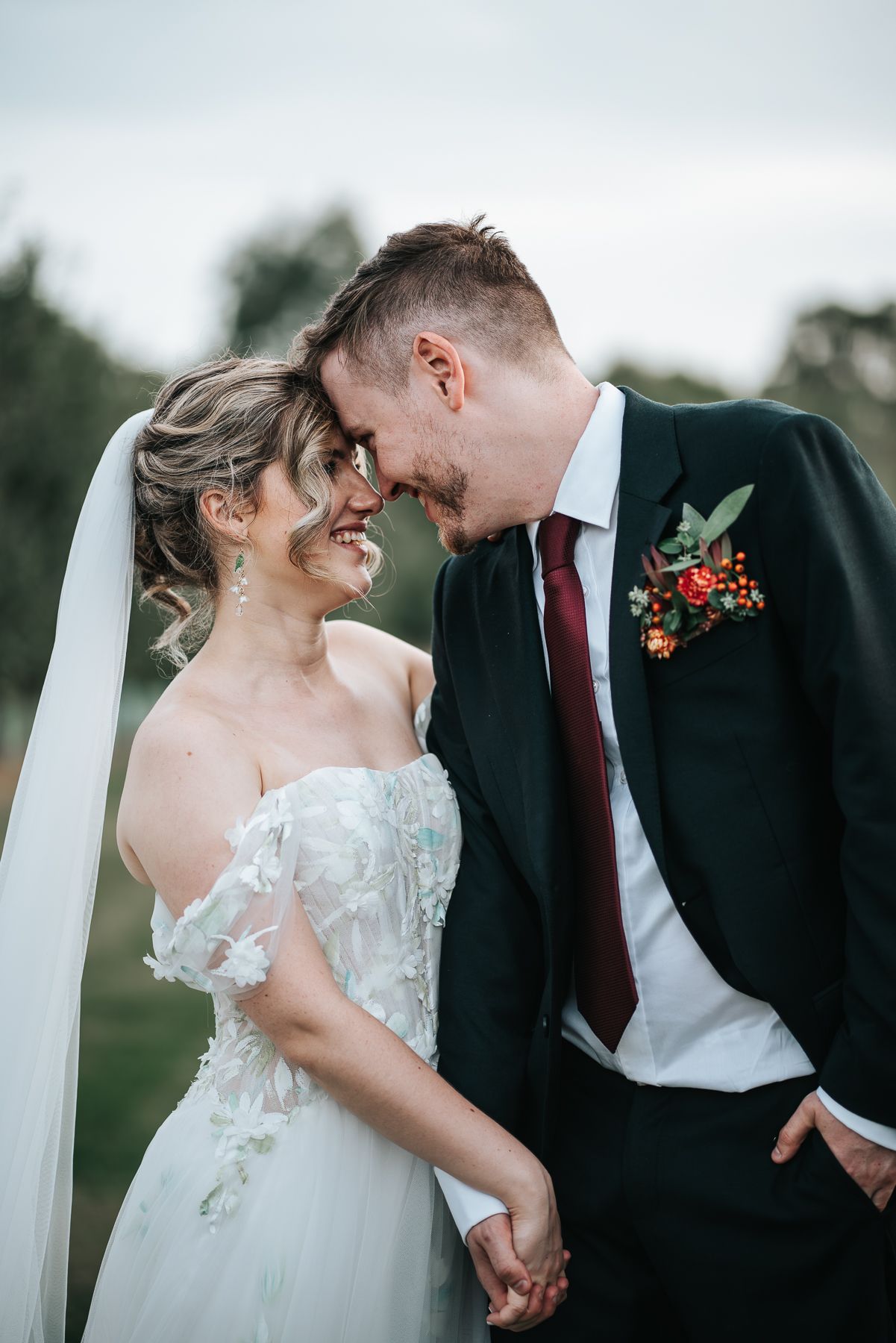Bride and groom share an intimate moment after ceremony taken by a Melbourne wedding photographer.