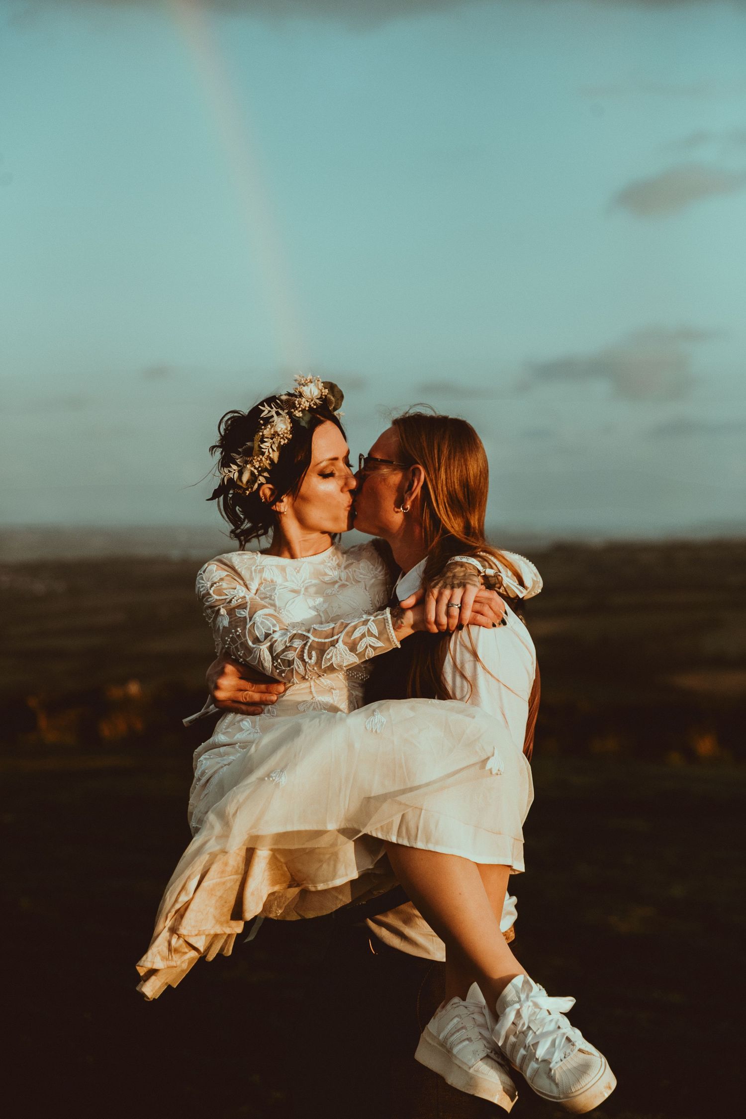 A couple in wedding attire share intimate moments at sunset across a series of romantic outdoor portraits.
