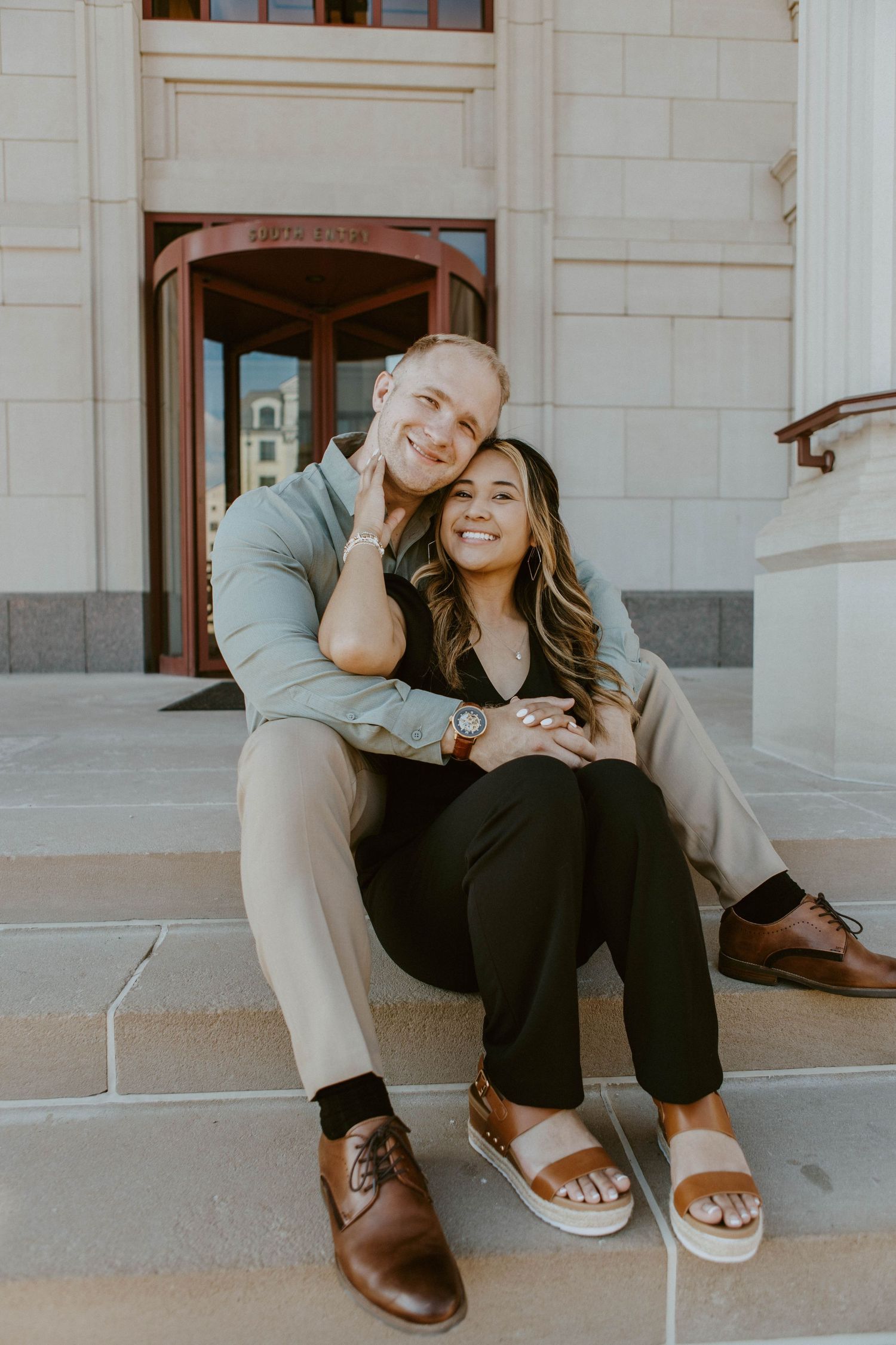 A couple sits together on concrete steps sharing intimate moments in a series of candid photographs.