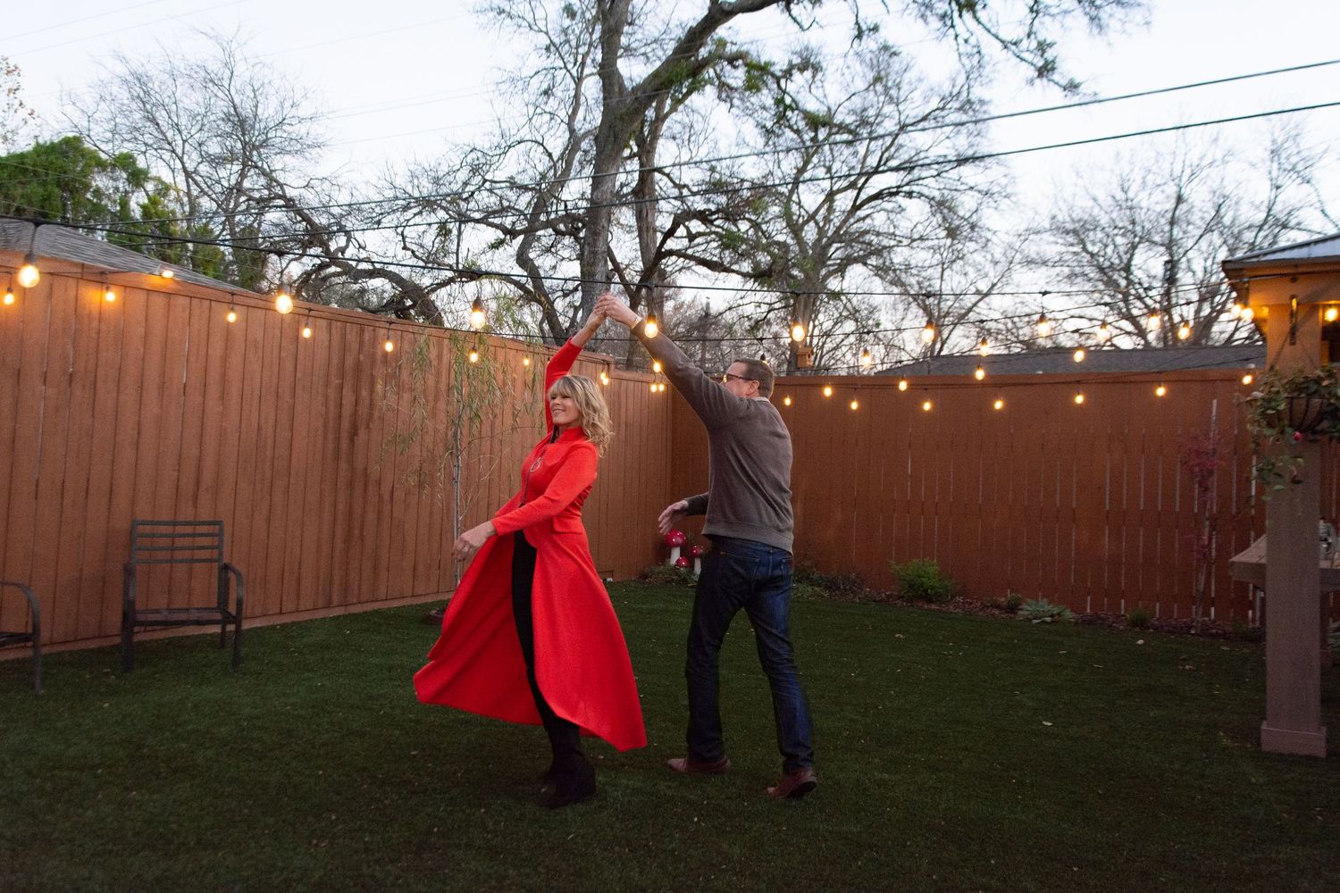Husband spins his wife around as they dance together.  Photo Credit: Gernelle Nelson. Plano, TX
