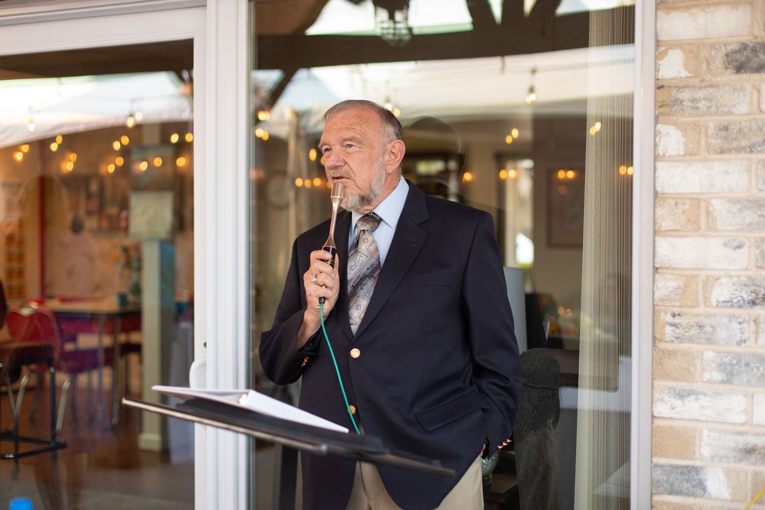 A speaker delivers remarks during a formal event.