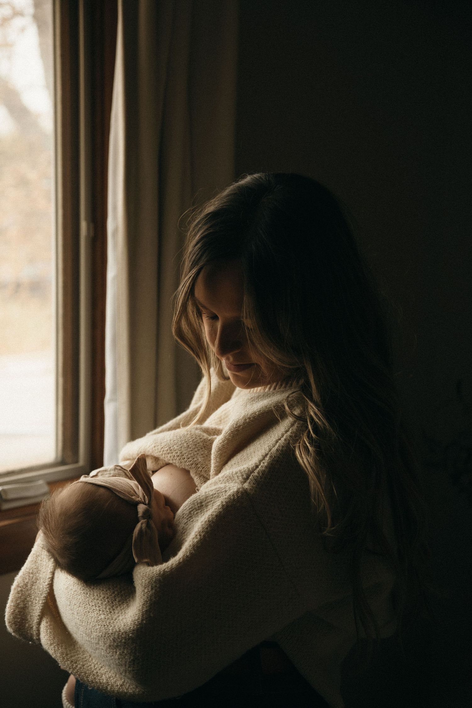 Soft natural light streams through a window illuminating a cozy indoor scene.