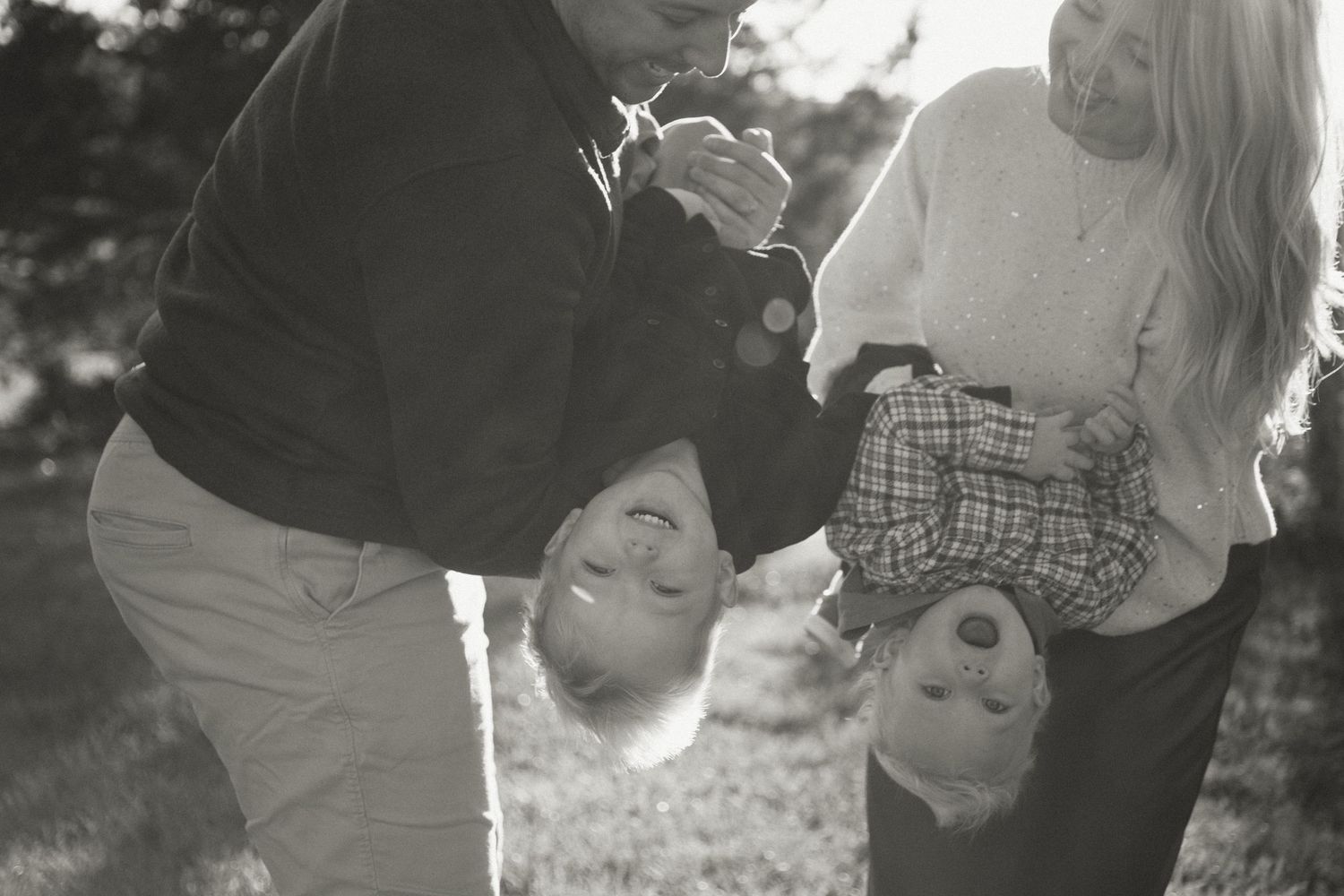 Black and white portraits show intimate moments between couples in an outdoor setting.