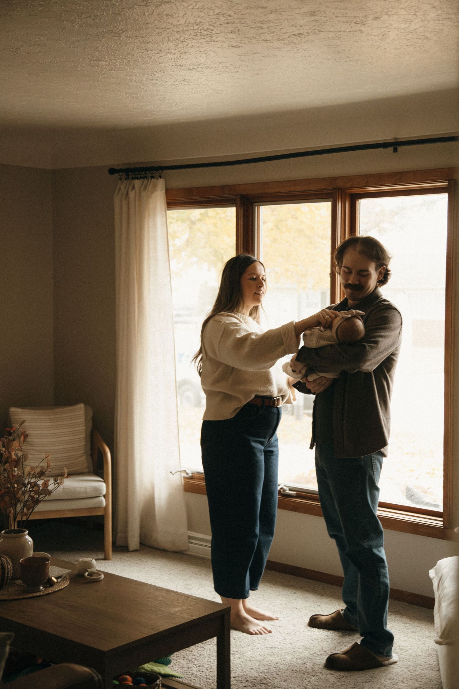 A sequence of photos showing a couple dancing together in a sunlit room.