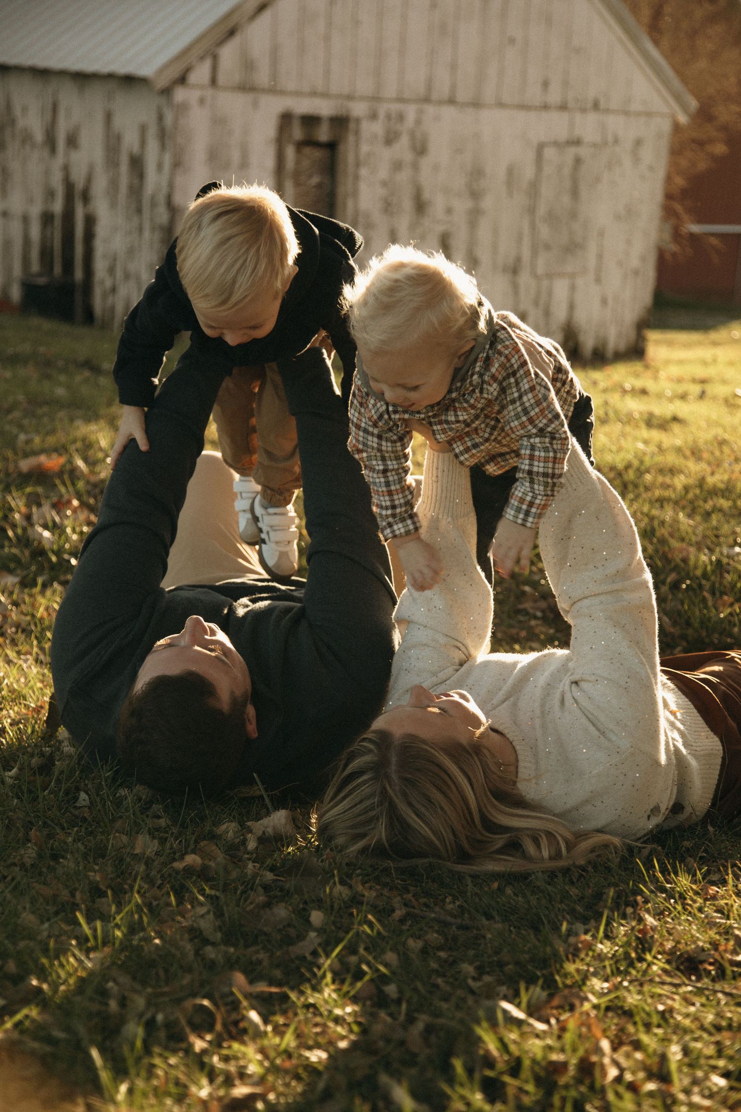 Playful moments captured in the grass during a warm autumn evening.