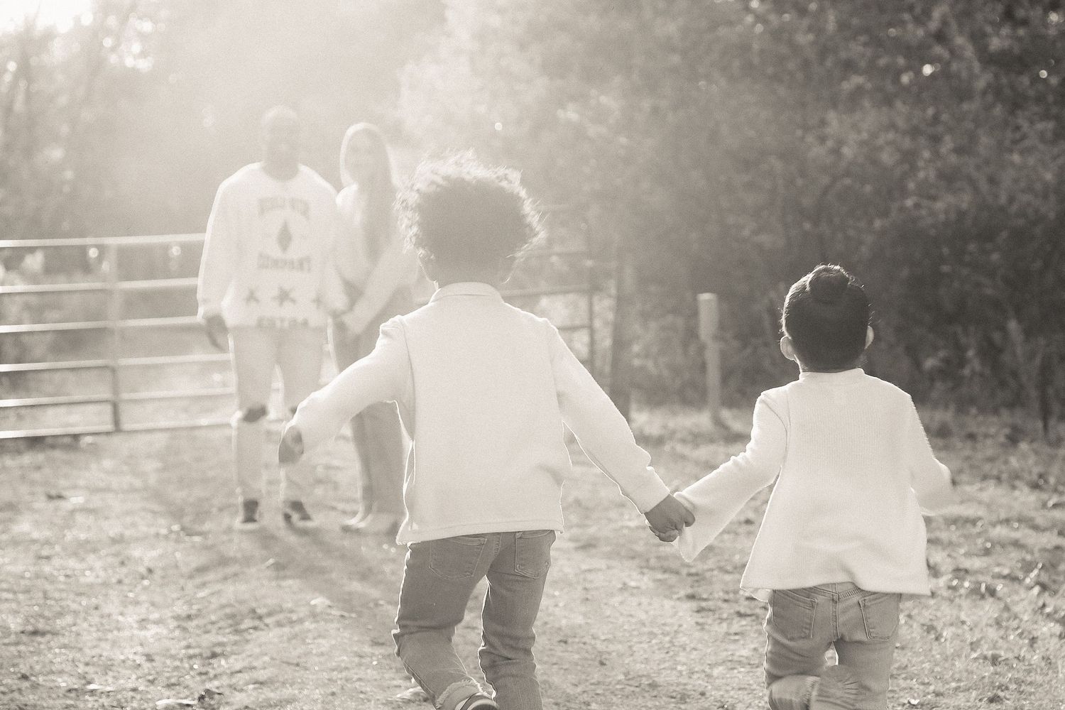 Soft focus black and white sequence of couple walking together in a pastoral setting.