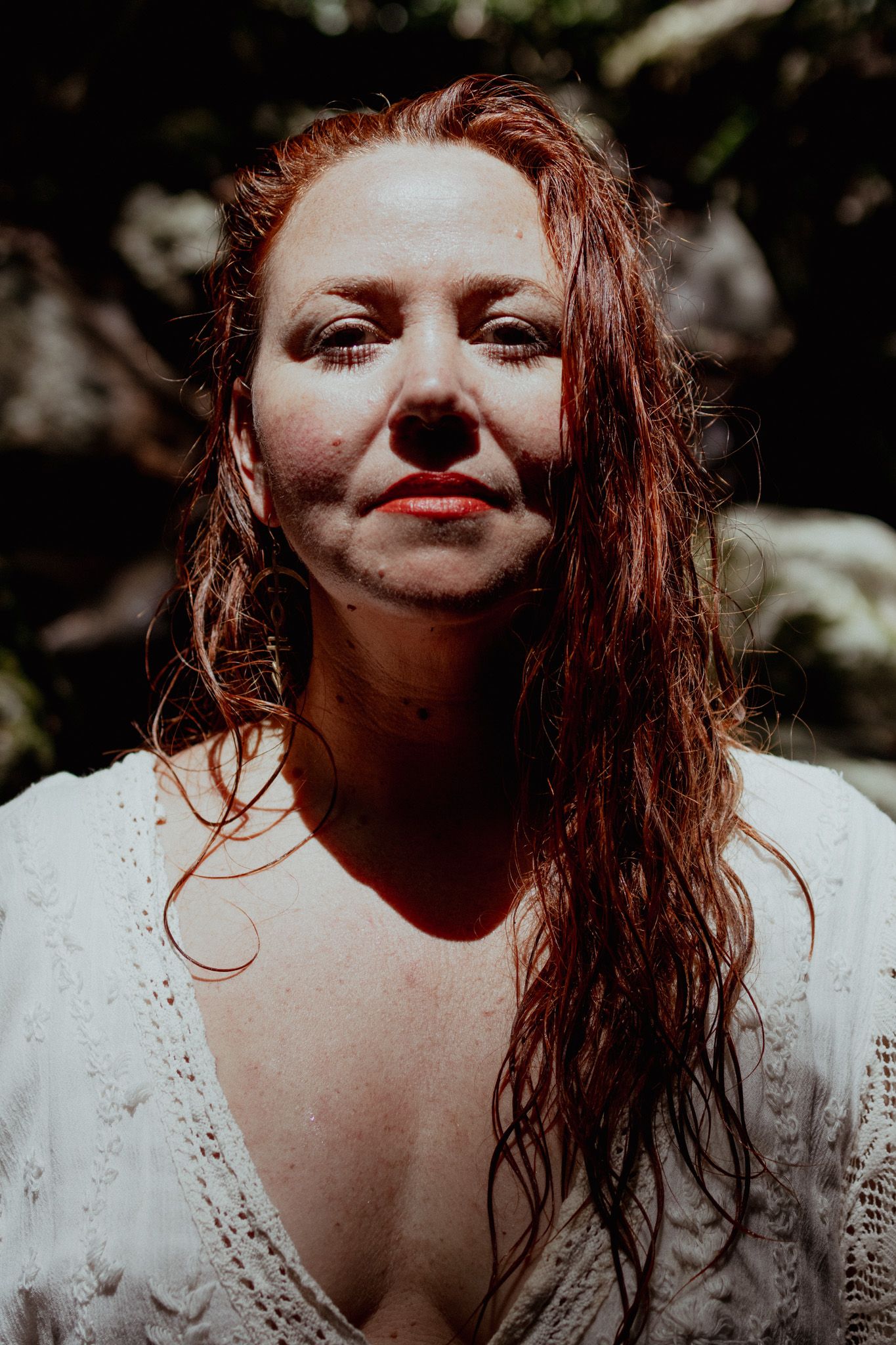 Close-up portrait series with dramatic lighting and natural outdoor backdrop.