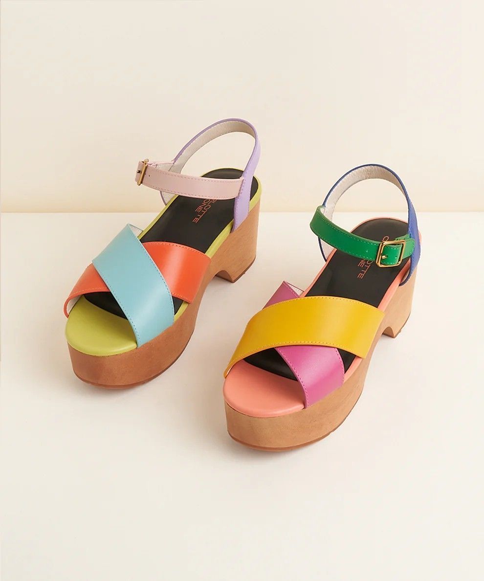 Colorful multicolor block heel platform sandals with criss-cross straps and ankle buckle closure on neutral background.