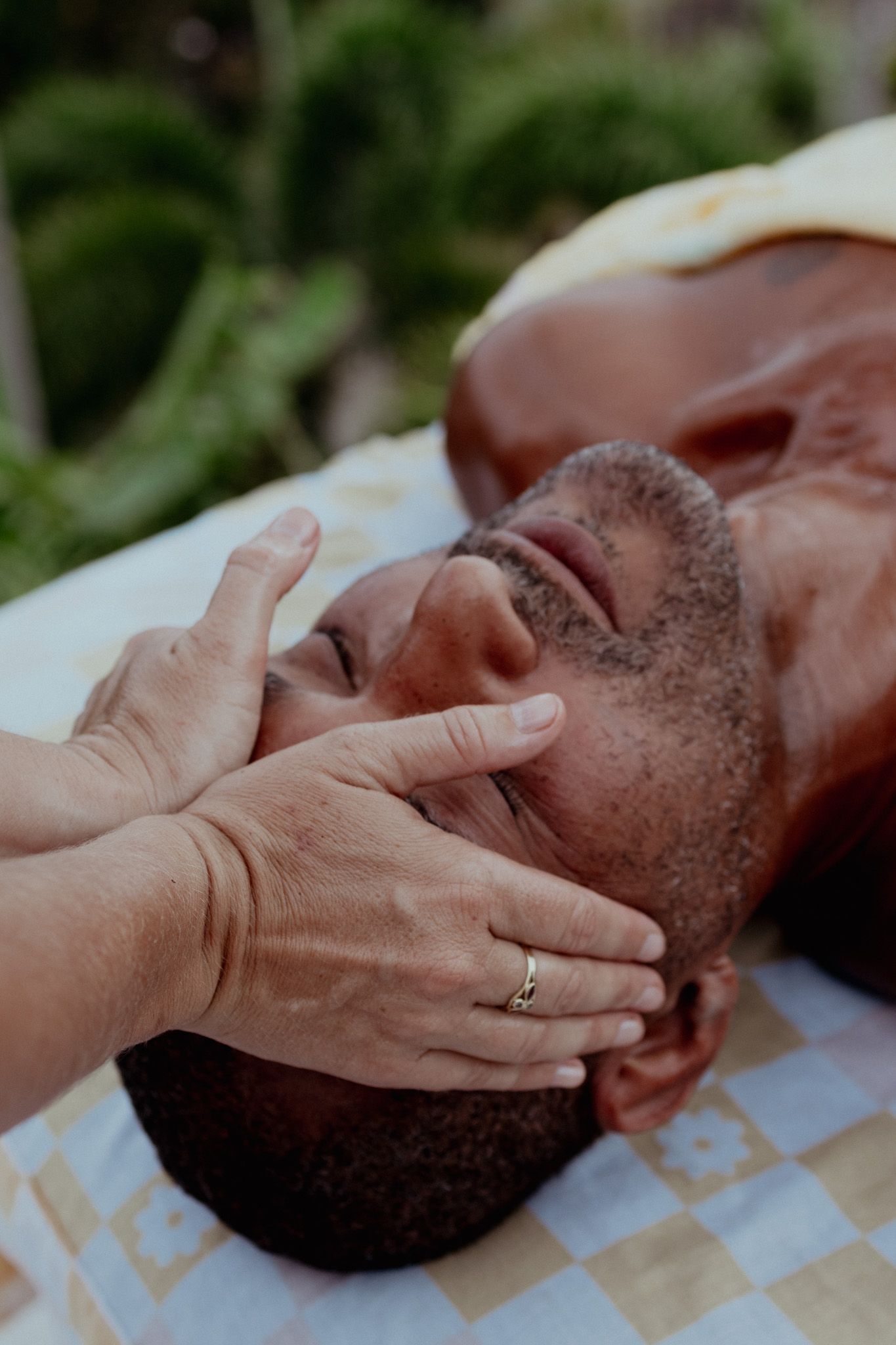 Gentle facial massage techniques being demonstrated during professional treatment.