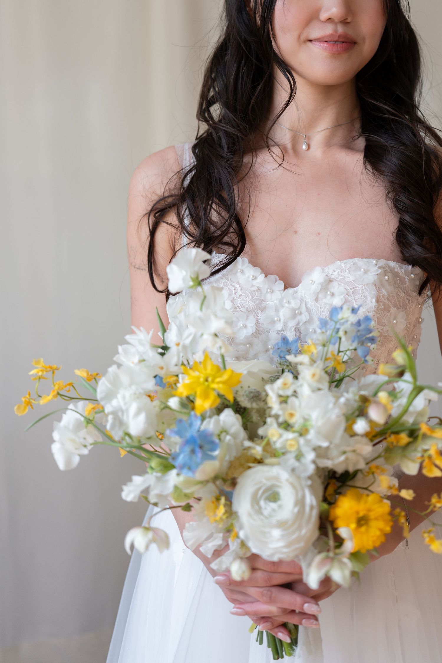 editorial photo of a bride holding flowers