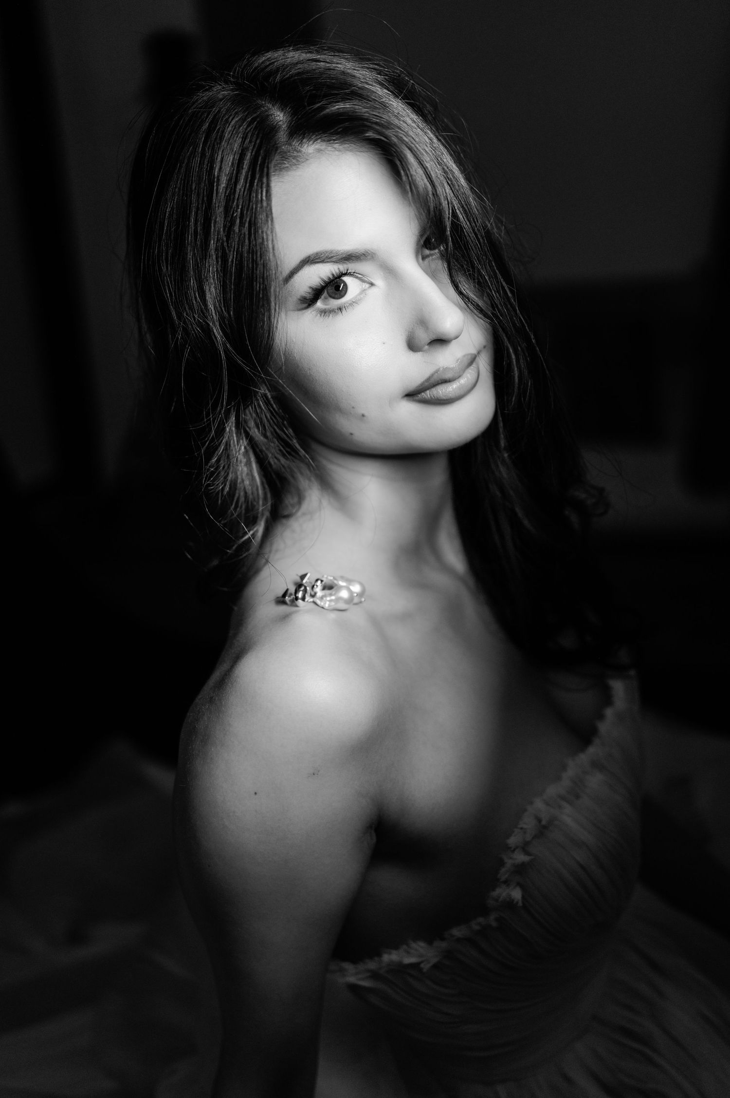 Black and white bridal portrait with dramatic lighting photographed in a Milford, Connecticut photography studio.