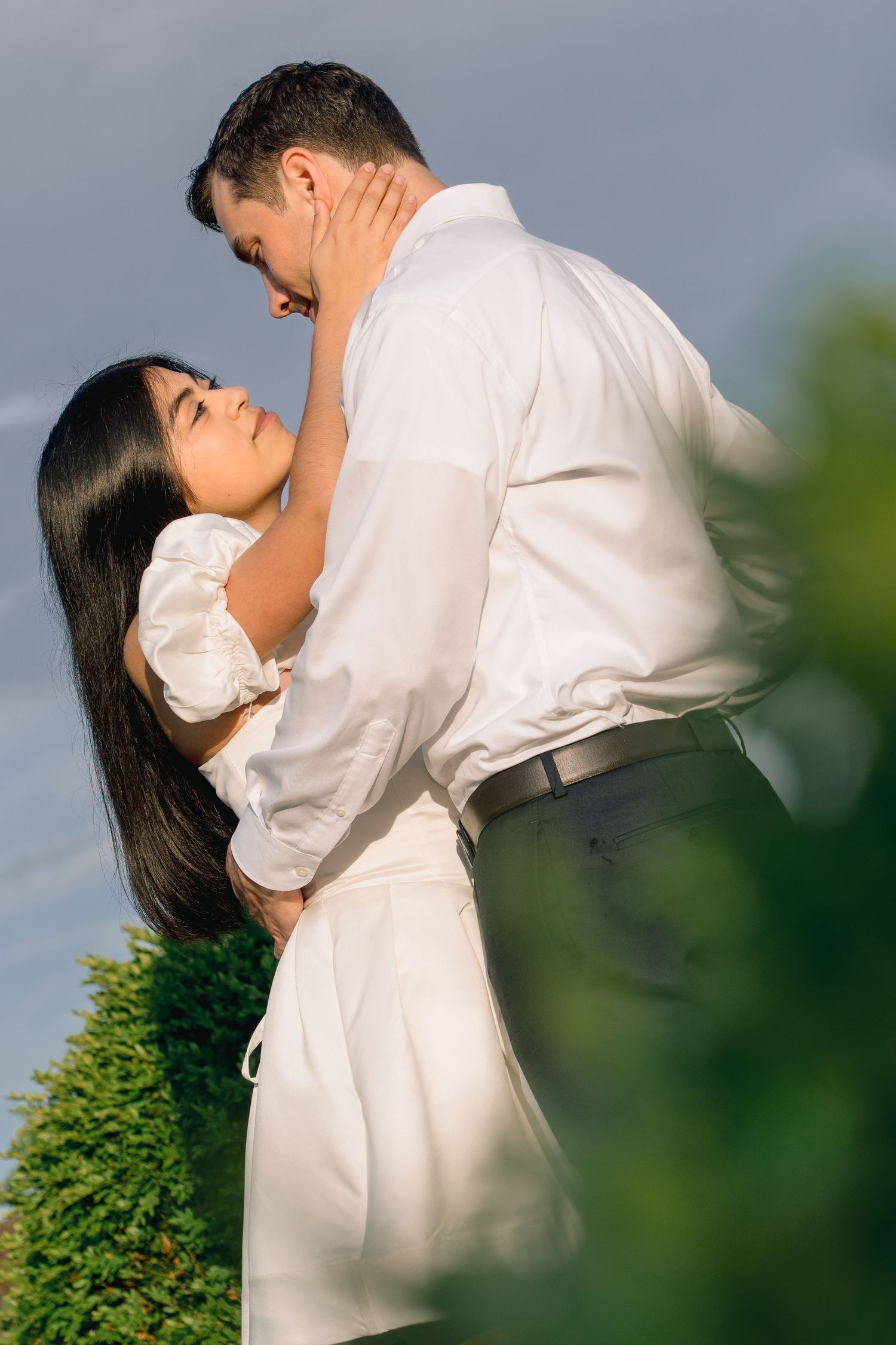 Romantic editorial engagement portrait of a couple embracing at Harkness Memorial State Park in Connecticut.