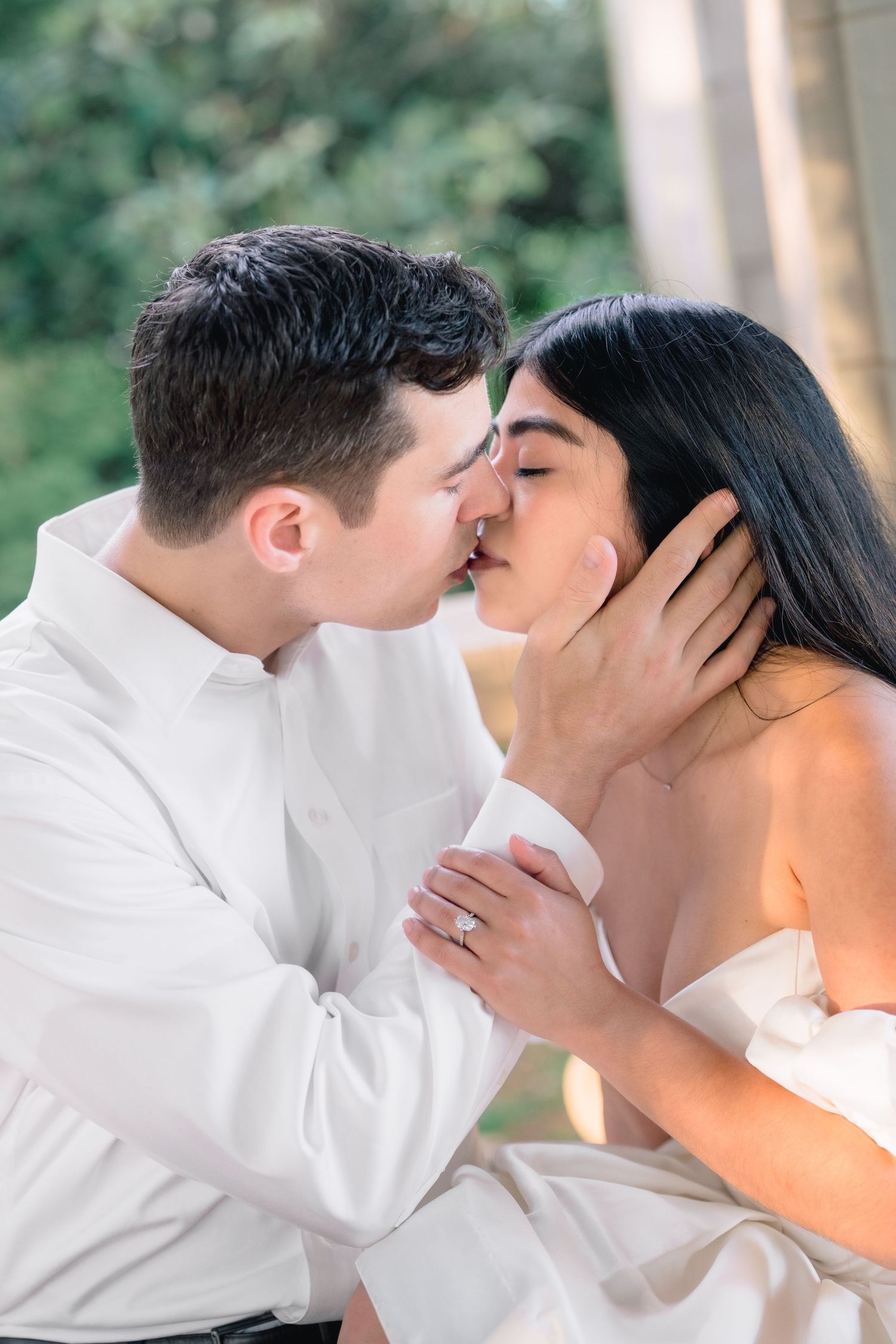 Close-up portrait of a couple sharing a kiss during an engagement session at Harkness Memorial State Park in Waterford, Connecticut.