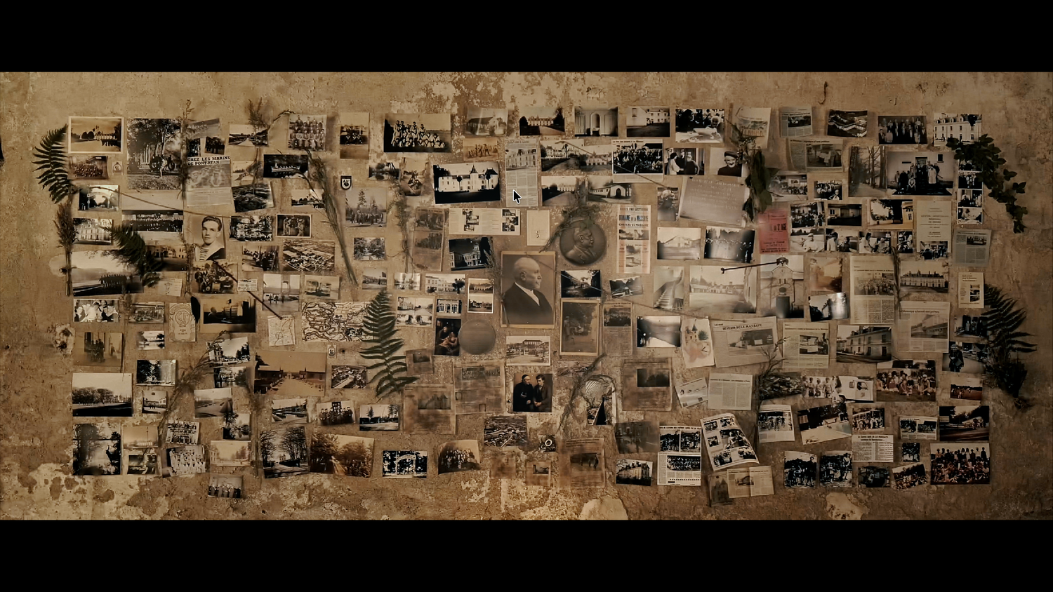 A vintage collage of old sepia-toned photographs arranged in a mosaic pattern on a textured brown background.