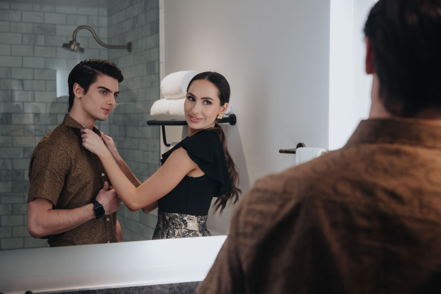 Couple sharing an intimate moment in a modern apartment setting.