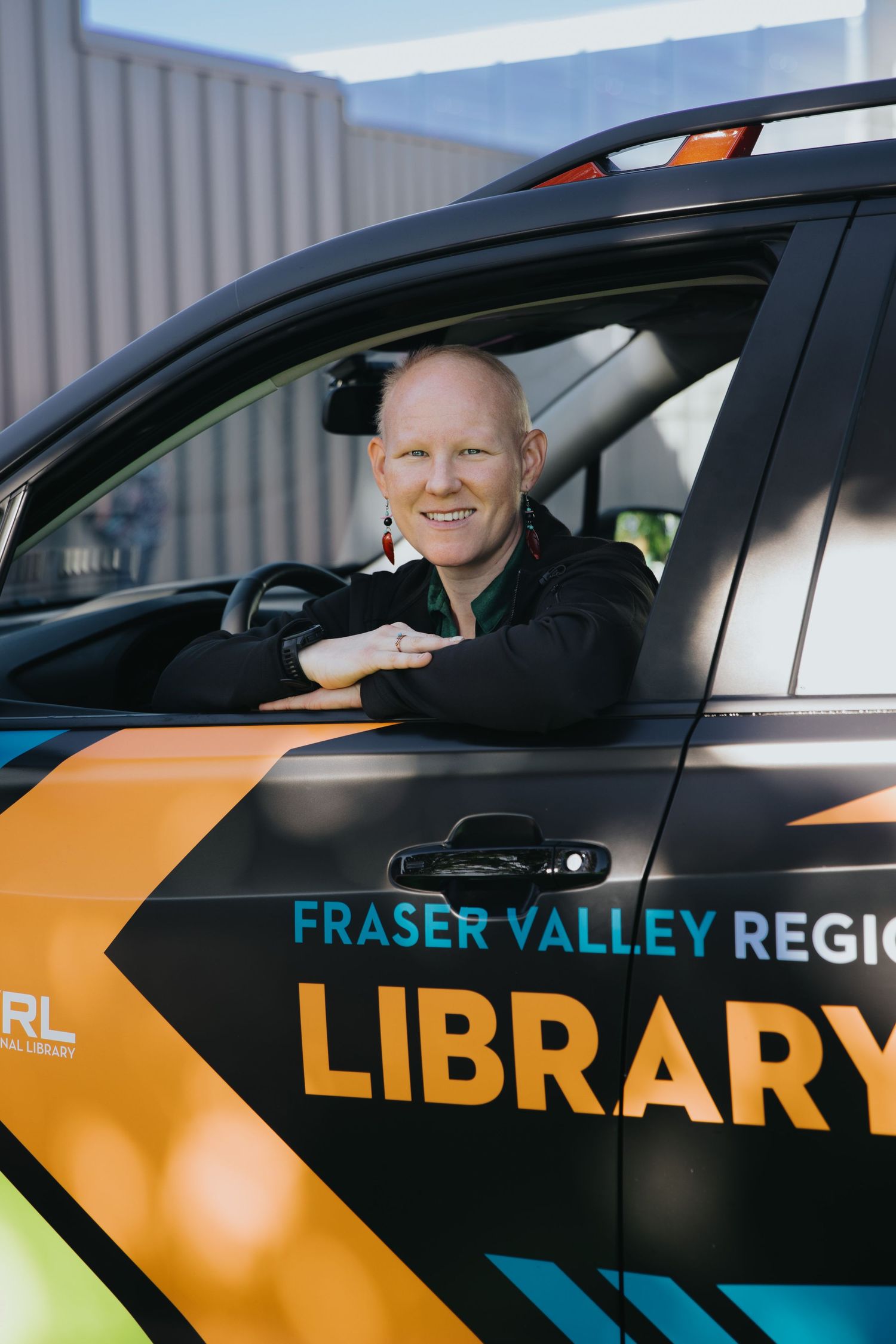 Fraser Valley Regional Library vehicle with distinctive orange and blue branding.