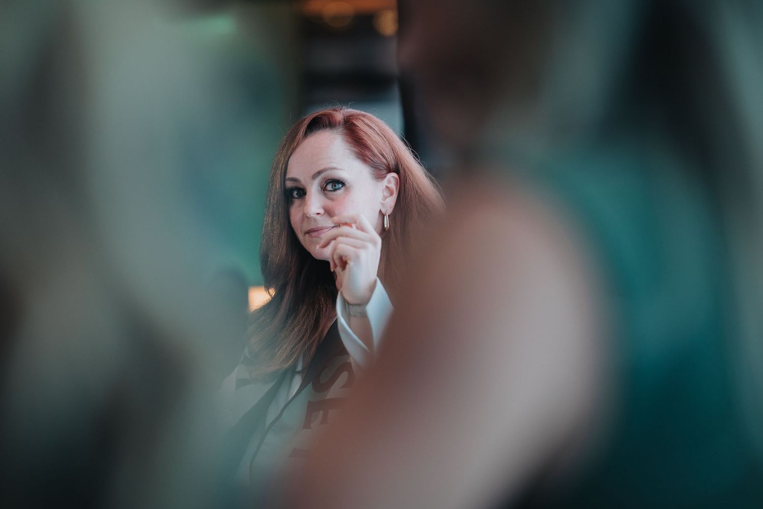 Close-up profile shot of presenter speaking at conference.