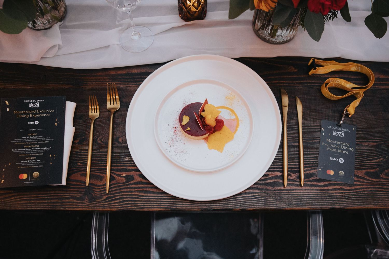 Fine dining table setup with floral centerpieces and ambient candlelight.