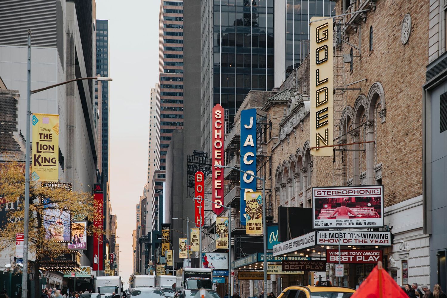Urban street view of downtown buildings with colorful signage and advertisements.