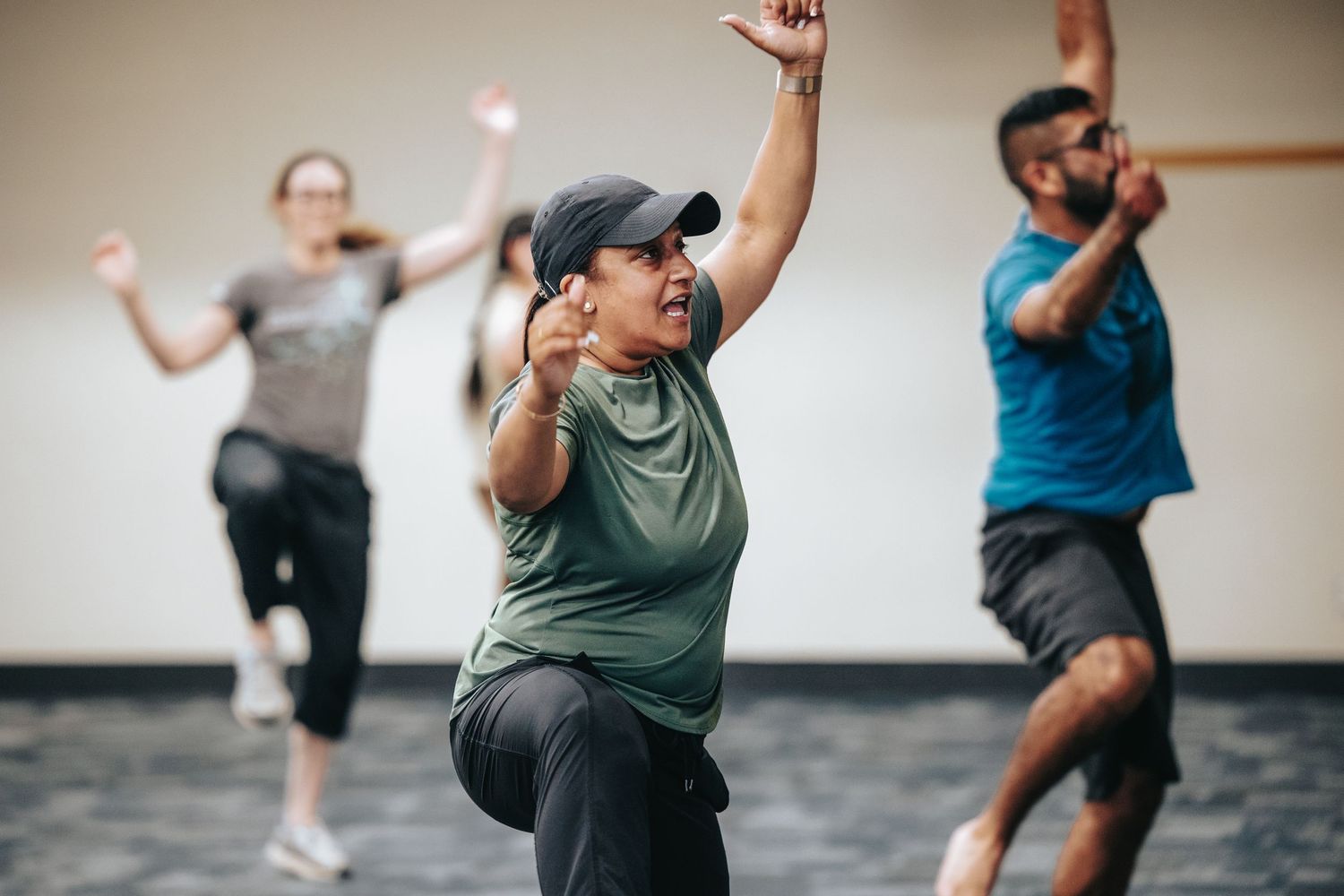 People participating in an indoor exercise or dance class.