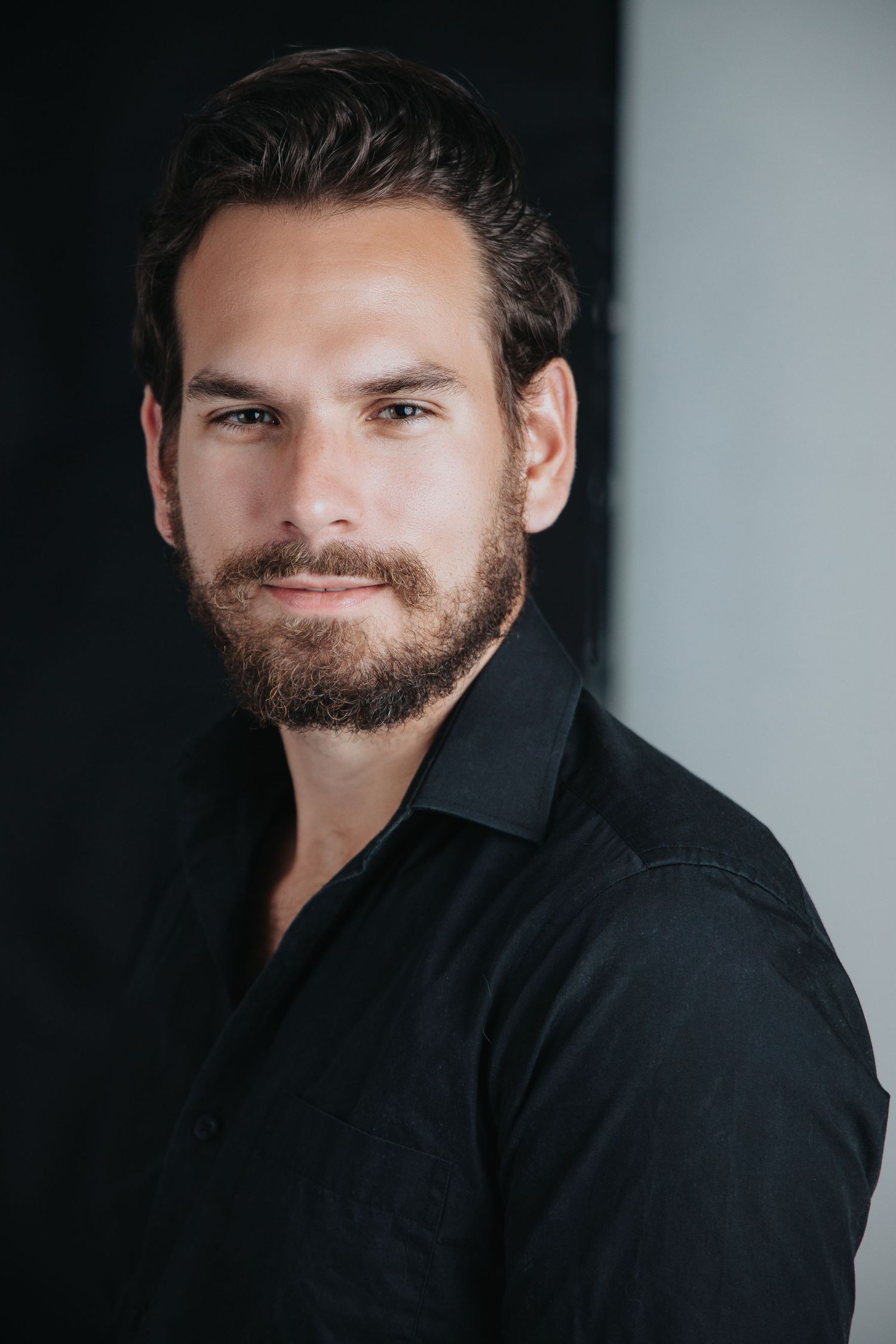 Portrait sequence showing person in black collared shirt with facial hair against gray backdrop.