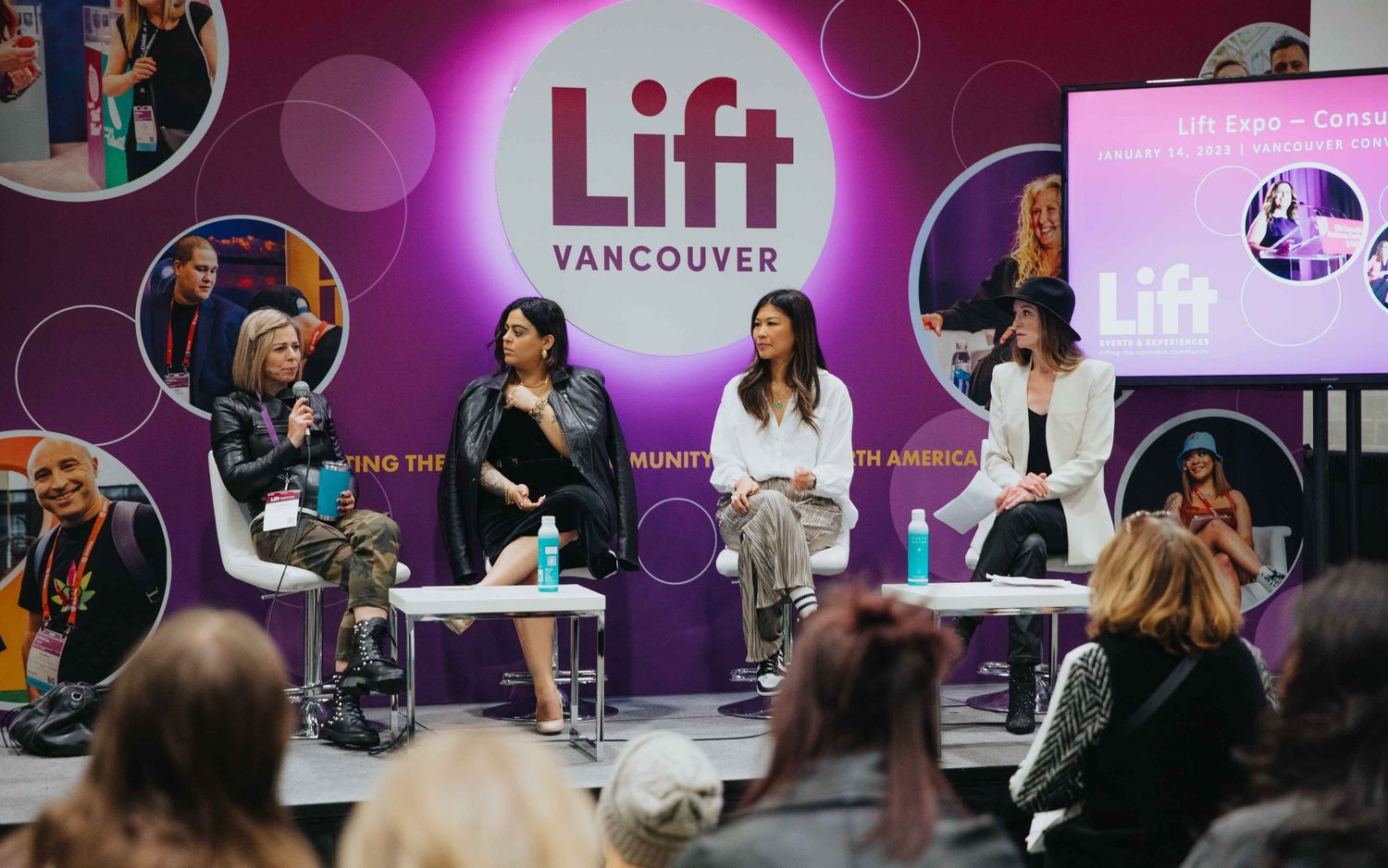 Panel discussion taking place on stage at a TIFF event with purple lighting and branding visible.