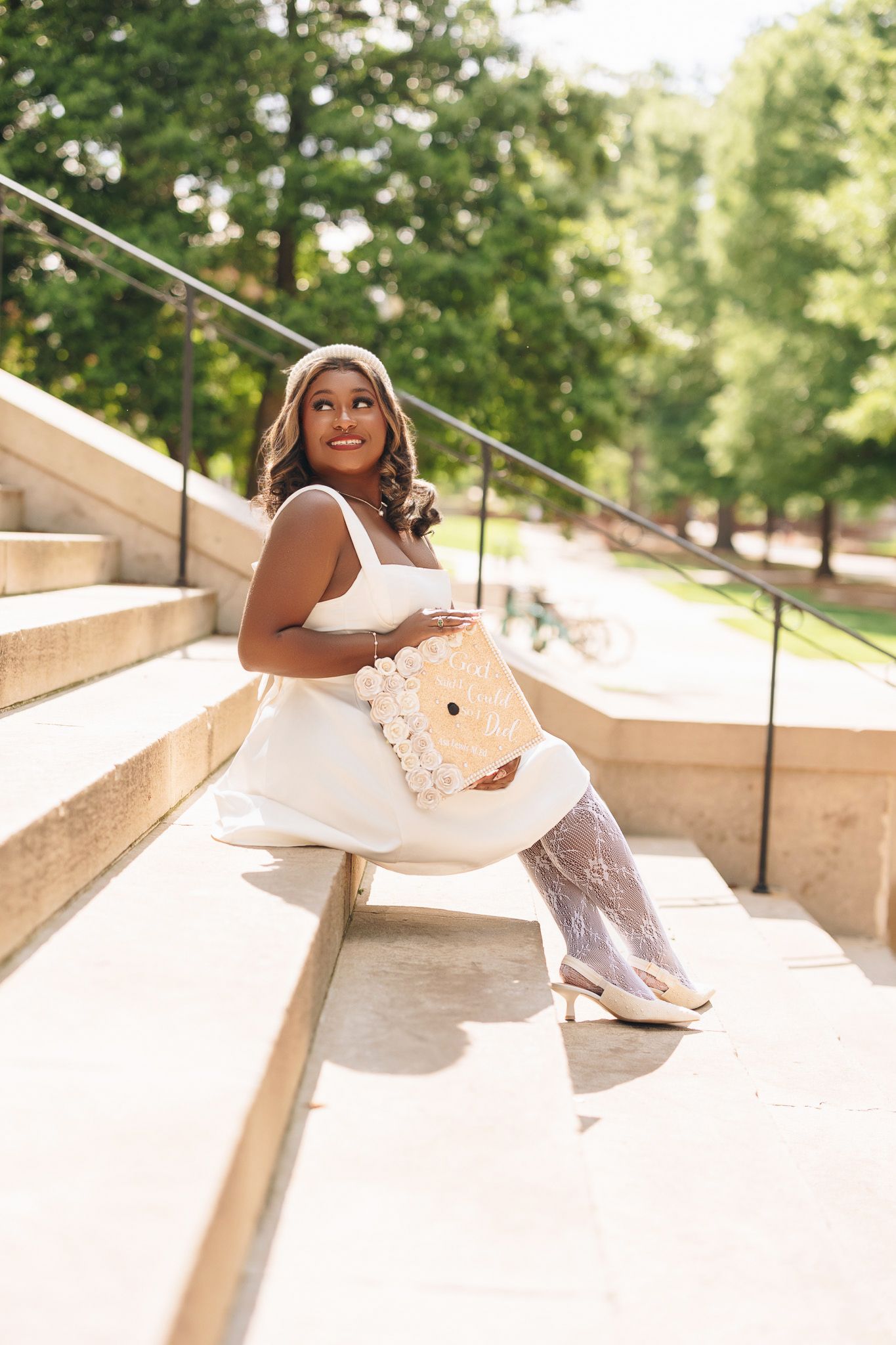 Outdoor portrait series on concrete steps in bright natural sunlight.