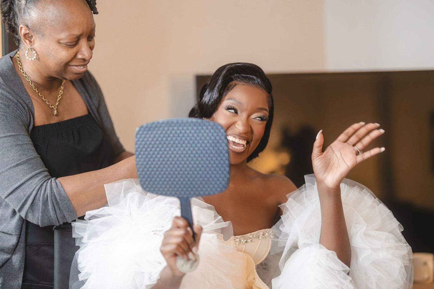 Candid moments captured during preparation with mirrors and natural reactions.