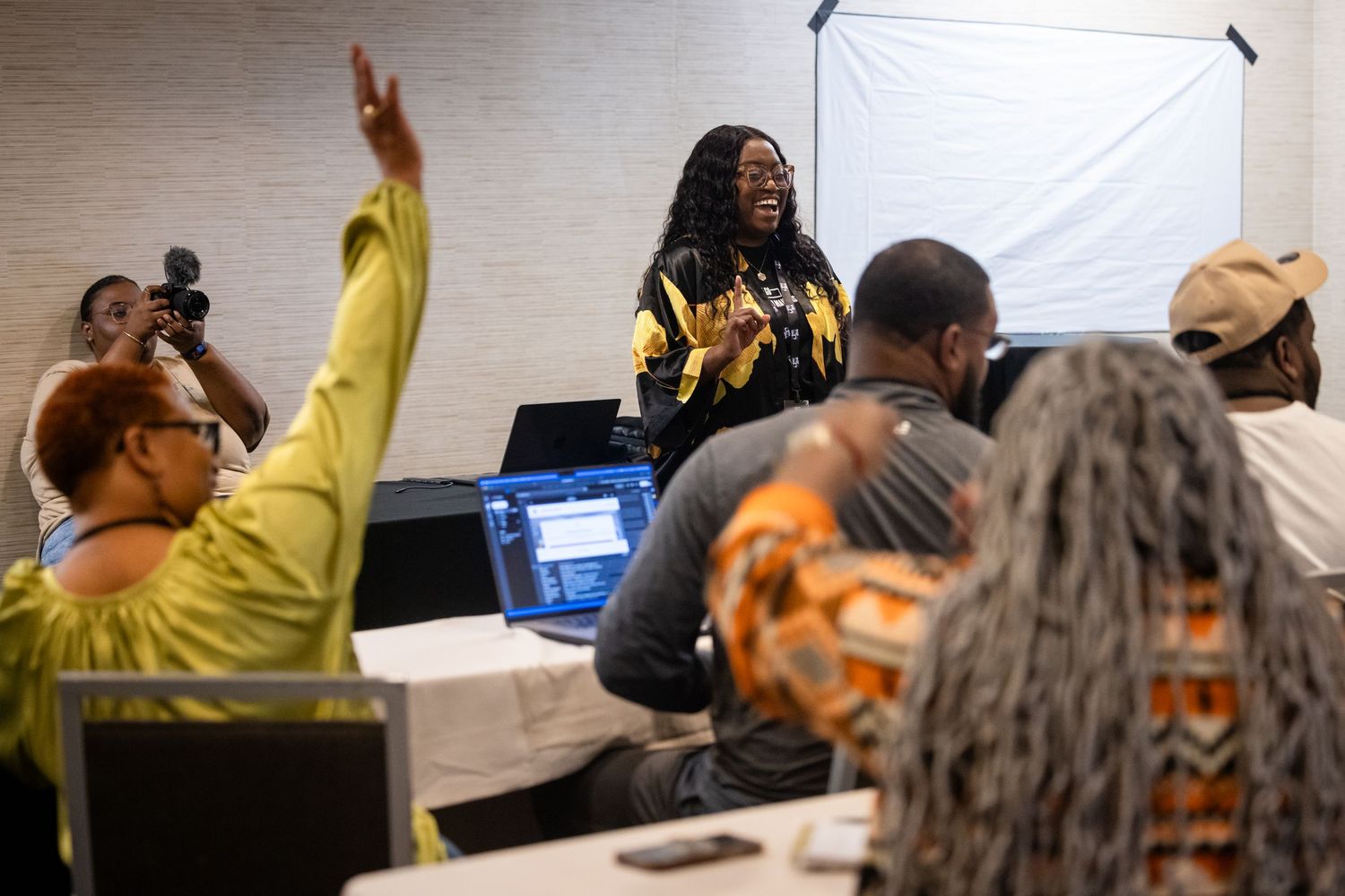 Group of people engaged in discussion during a professional development workshop.