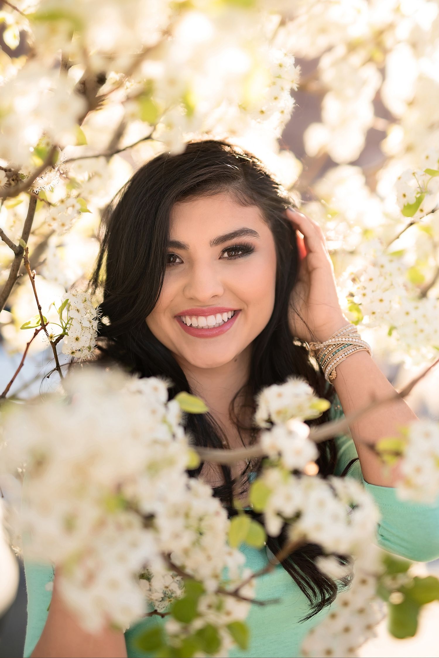 Senior girl in spring blossoms