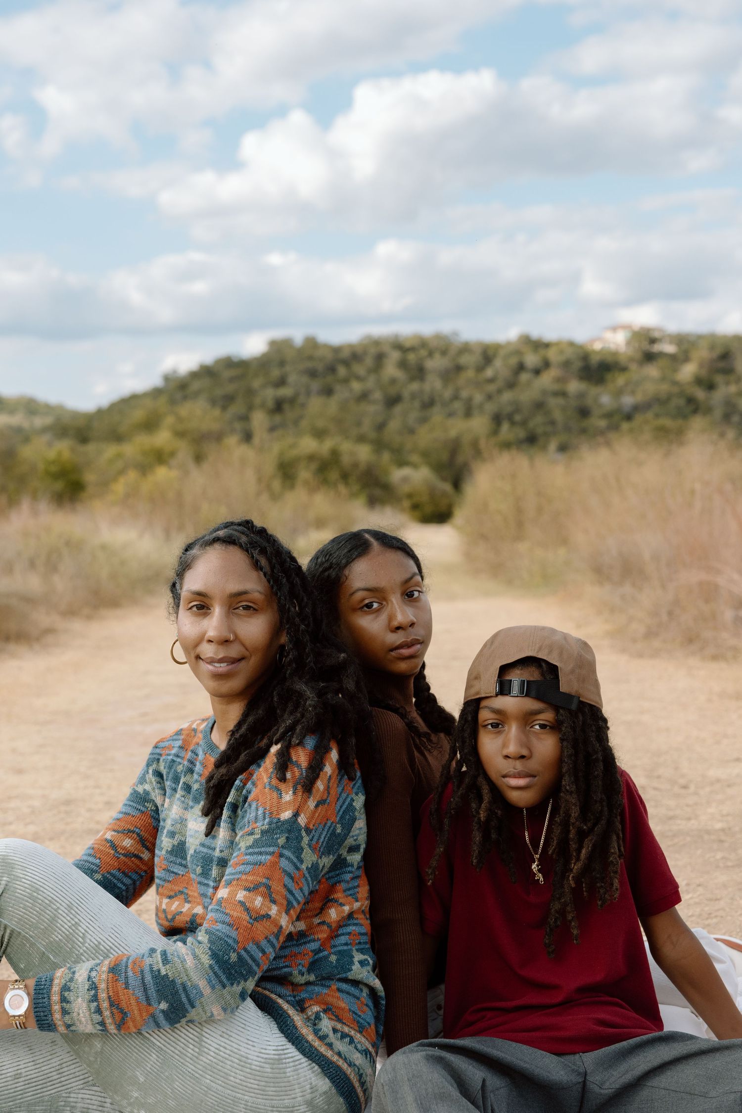 Family photography in Austin, Texas; mother and two children posed in editorial fashion