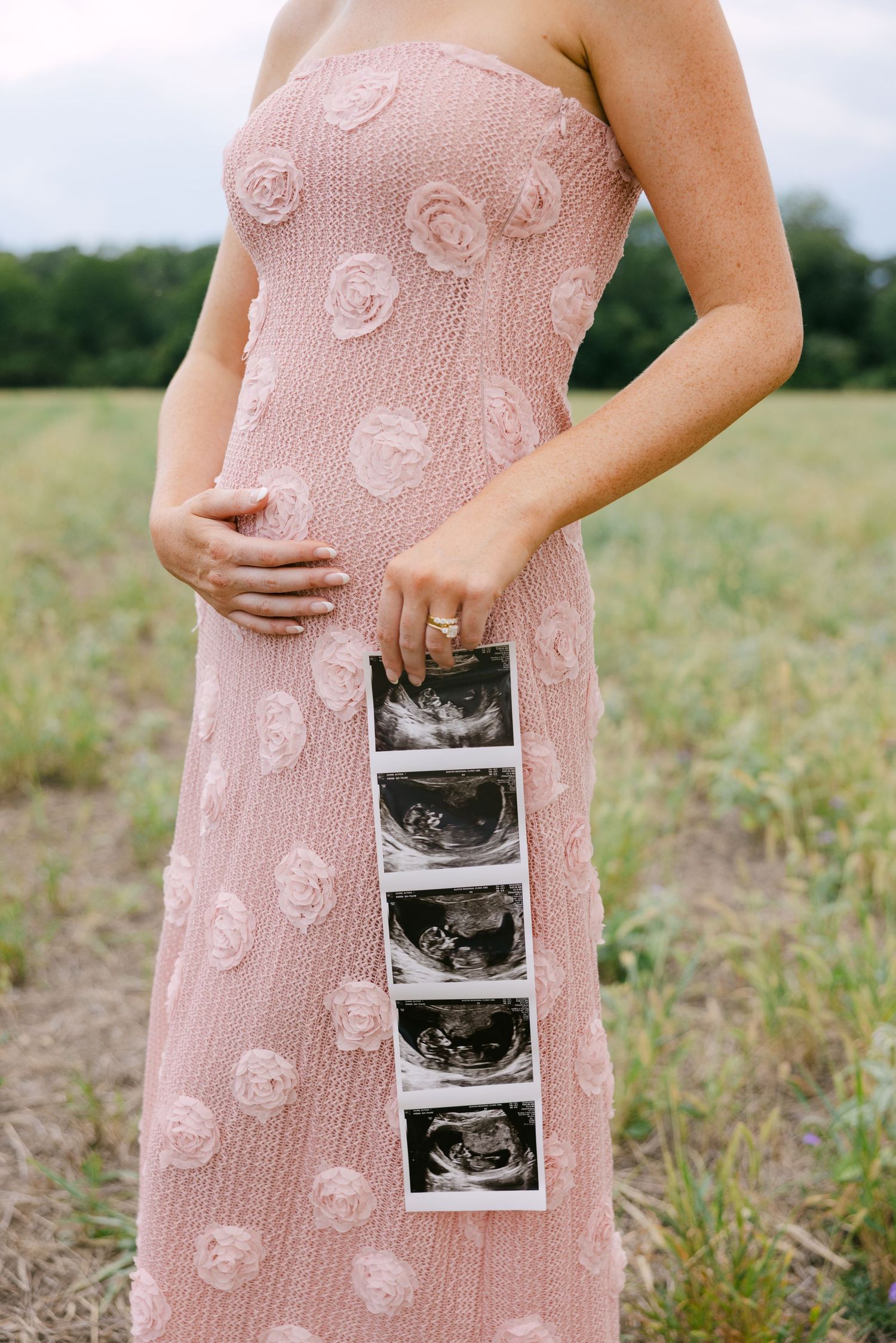 maternity session of mother holding pregnant belly in Austin, Texas; faceless family photo