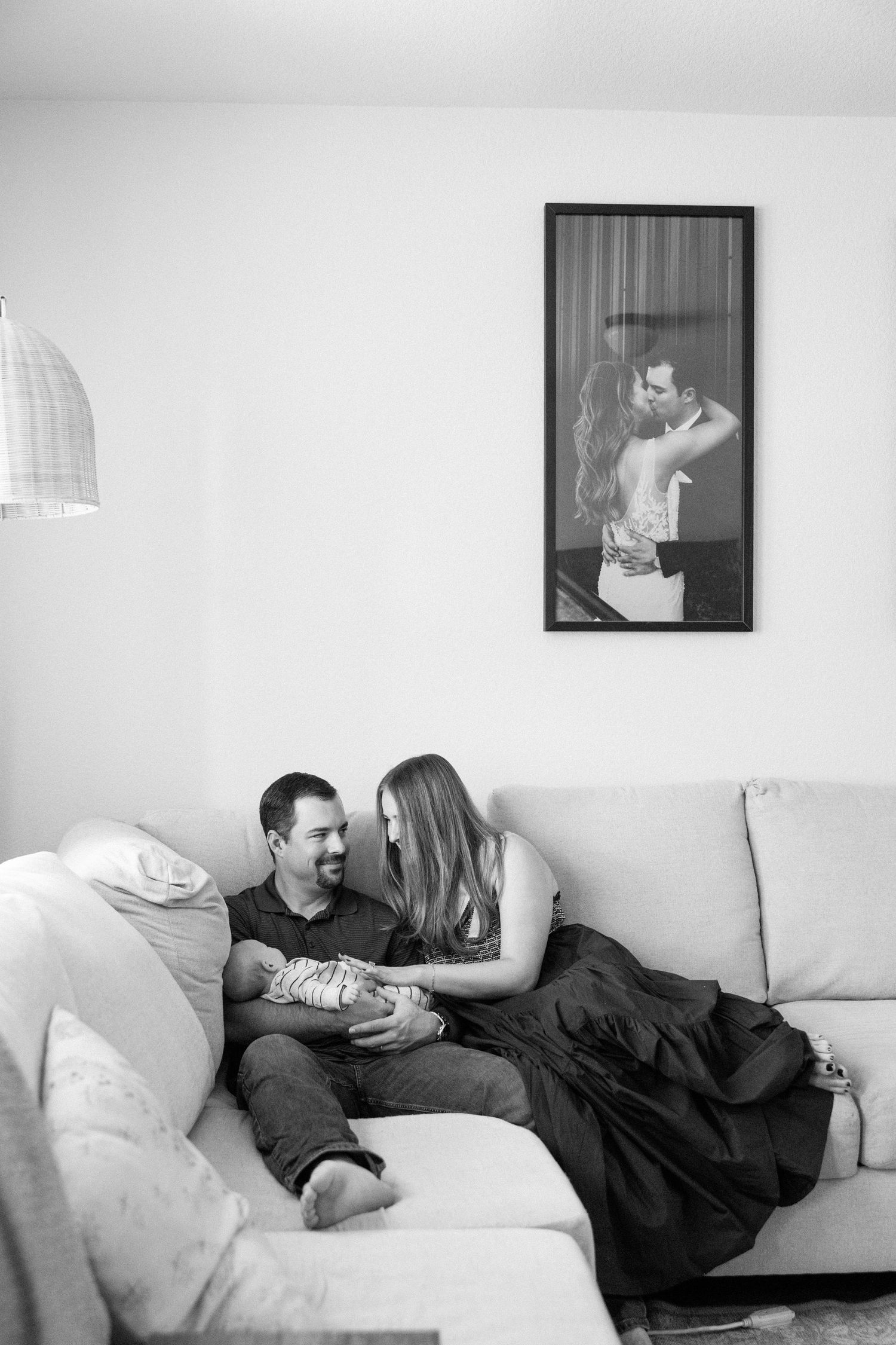 Newborn photograph of parents holding baby in Austin, Texas