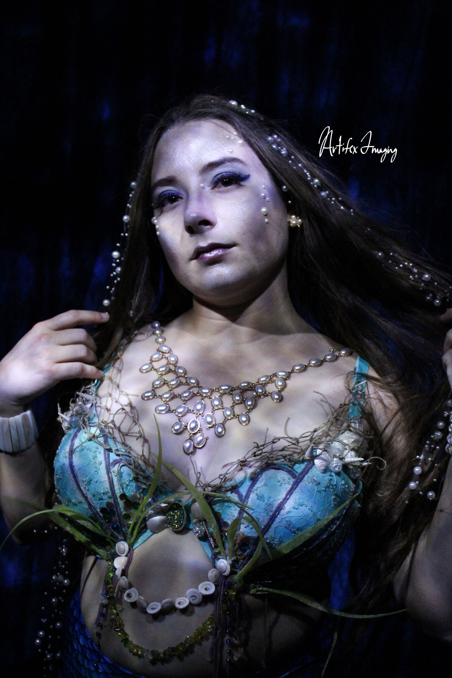 Mermaid image featuring a custom caustic lighting effect. Light built by Artifex Imaging. Image taken by Artifex Imaging in Bakersfield, CA.