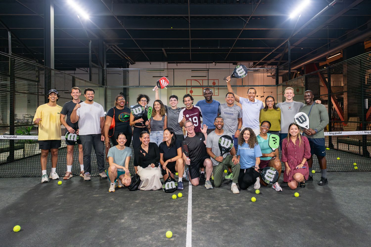 Indoor sports facility with multiple courts showing various recreational activities and players during gameplay sessions.