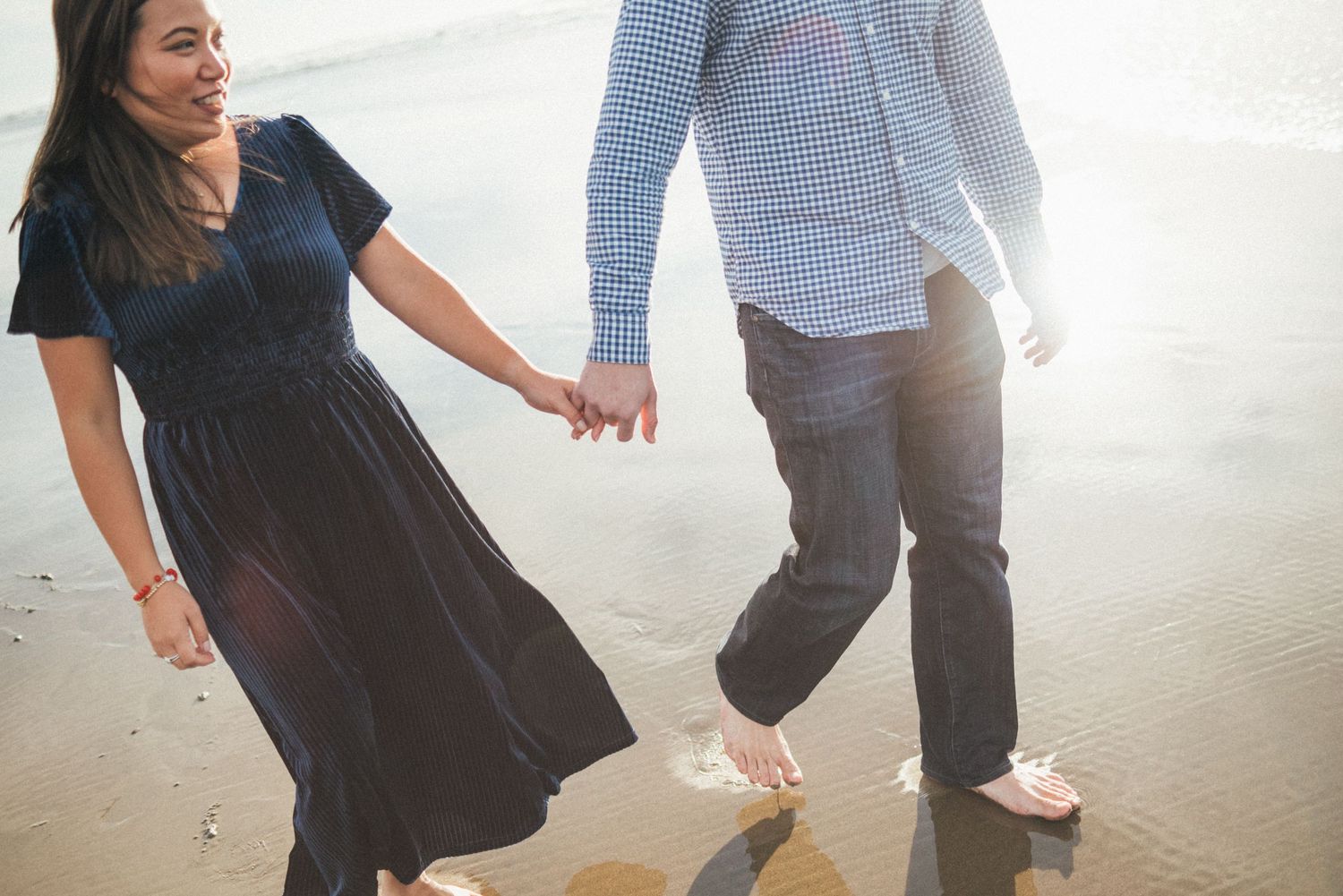 People dance and move together in a bright indoor space with white walls.