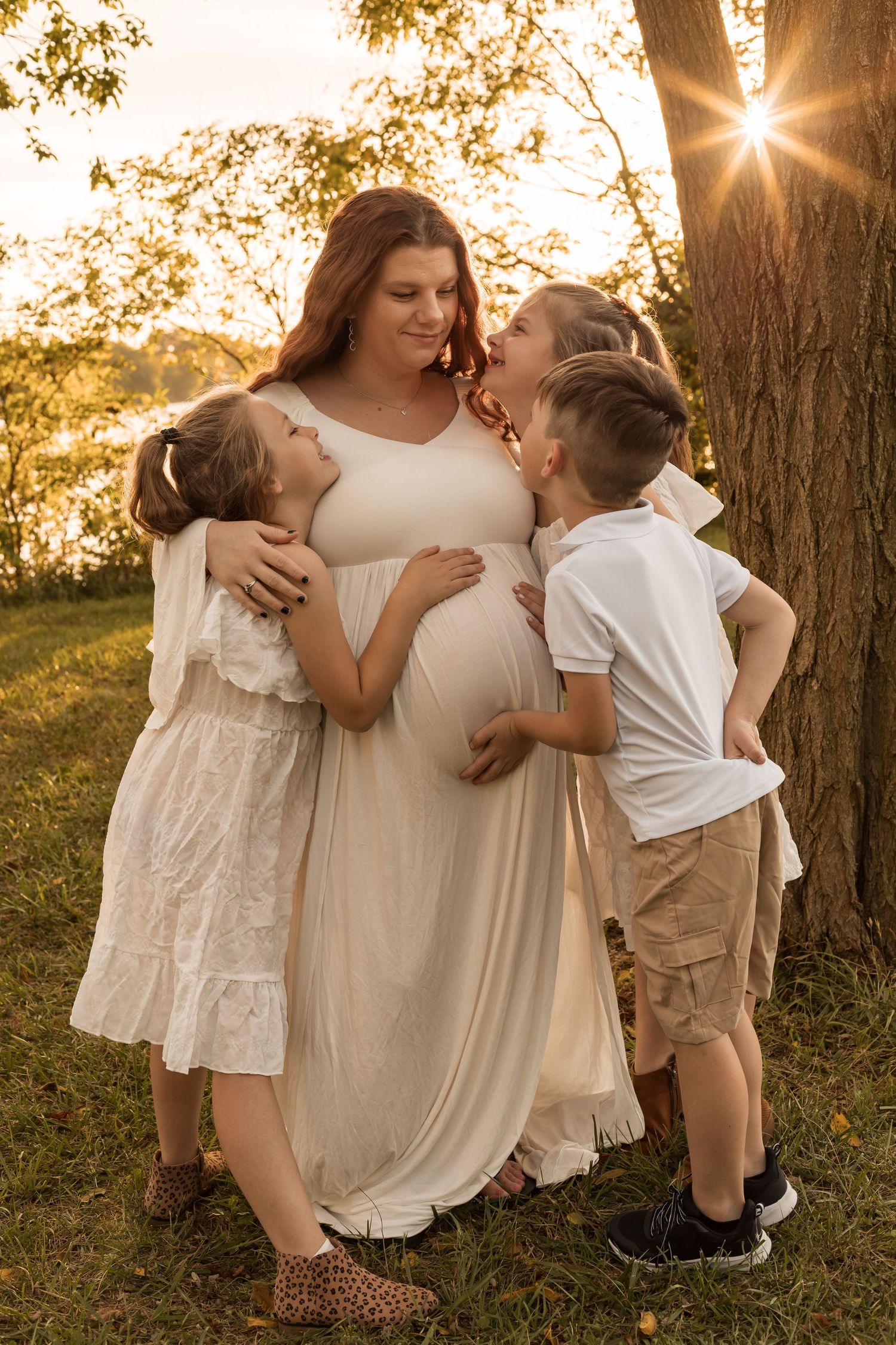 Family with young children enjoying a playful outdoor photography session during golden hour in Maryland.