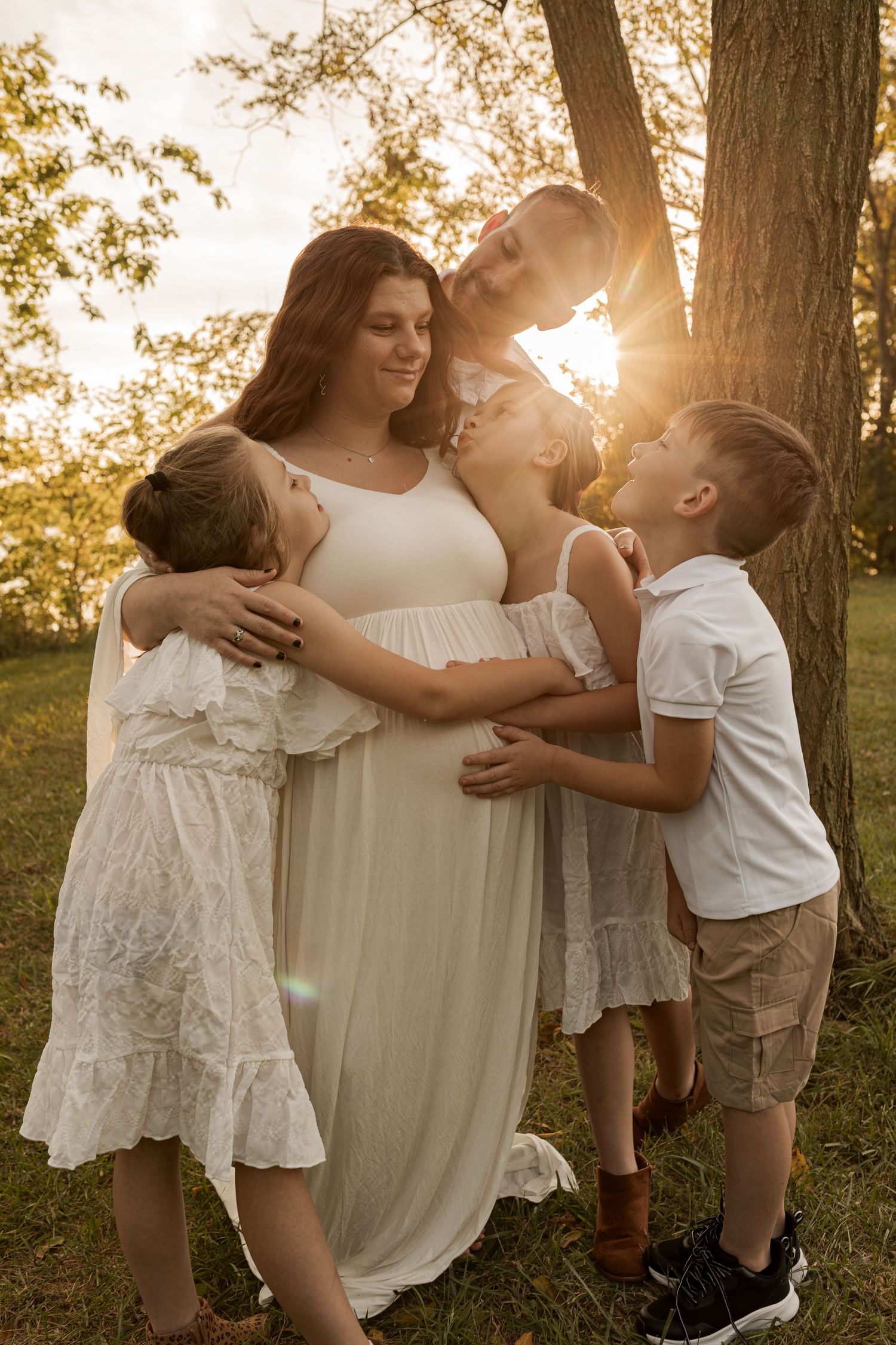Family enjoying a warm outdoor photography session together in Maryland during golden hour.