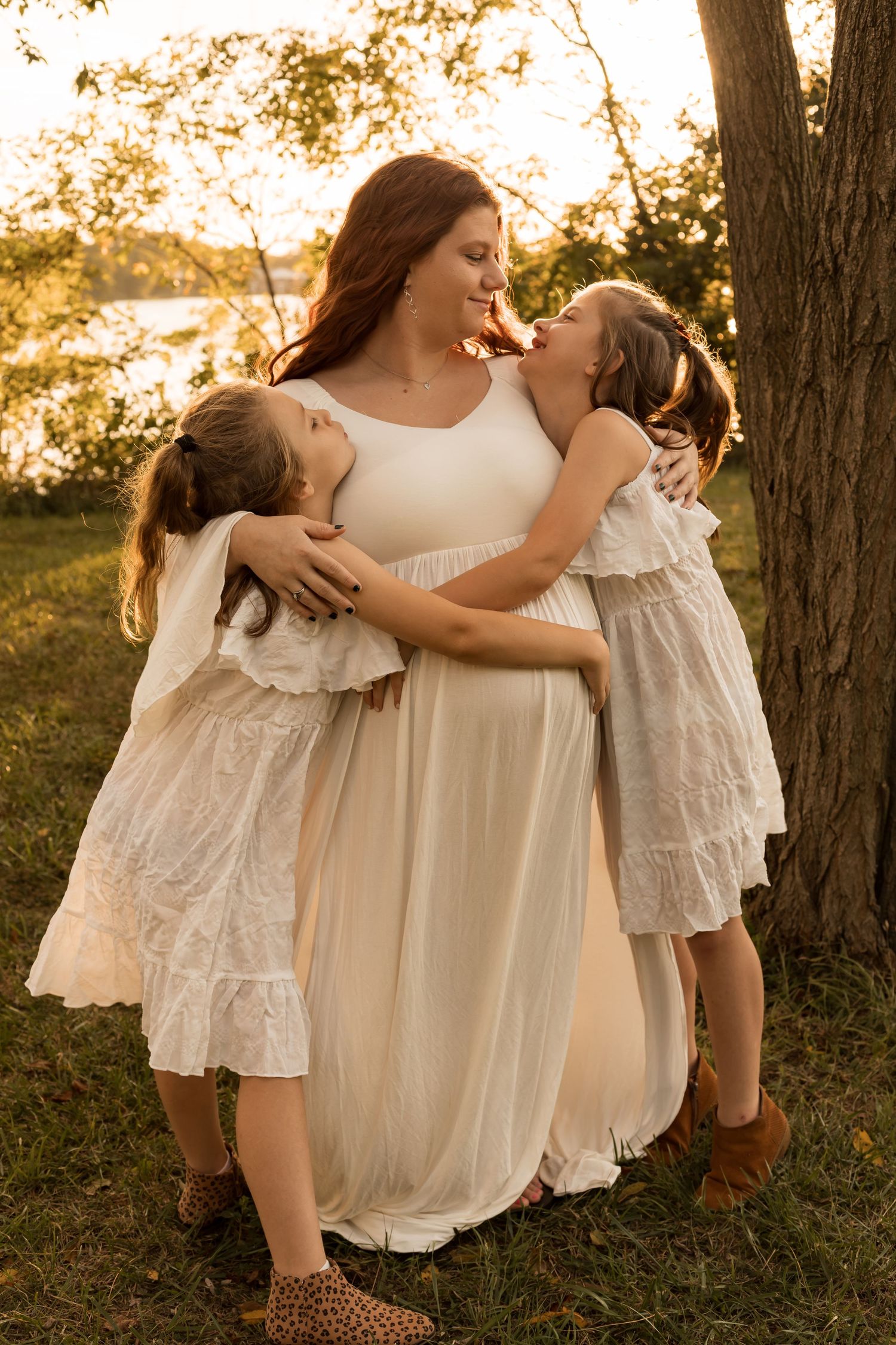 Family with young children enjoying a playful outdoor photography session during golden hour in Maryland.