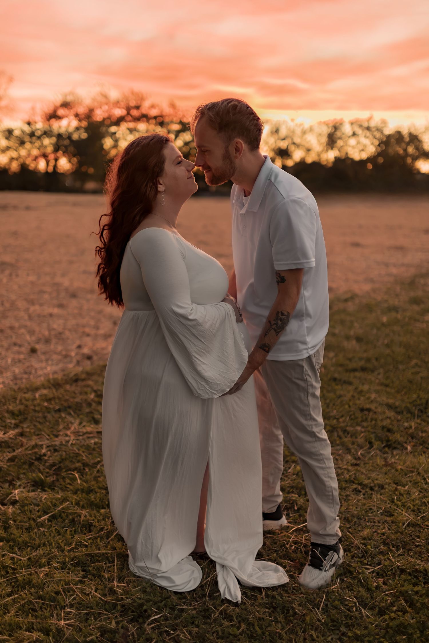 Couple embracing during a romantic outdoor photography session at sunset in Maryland.