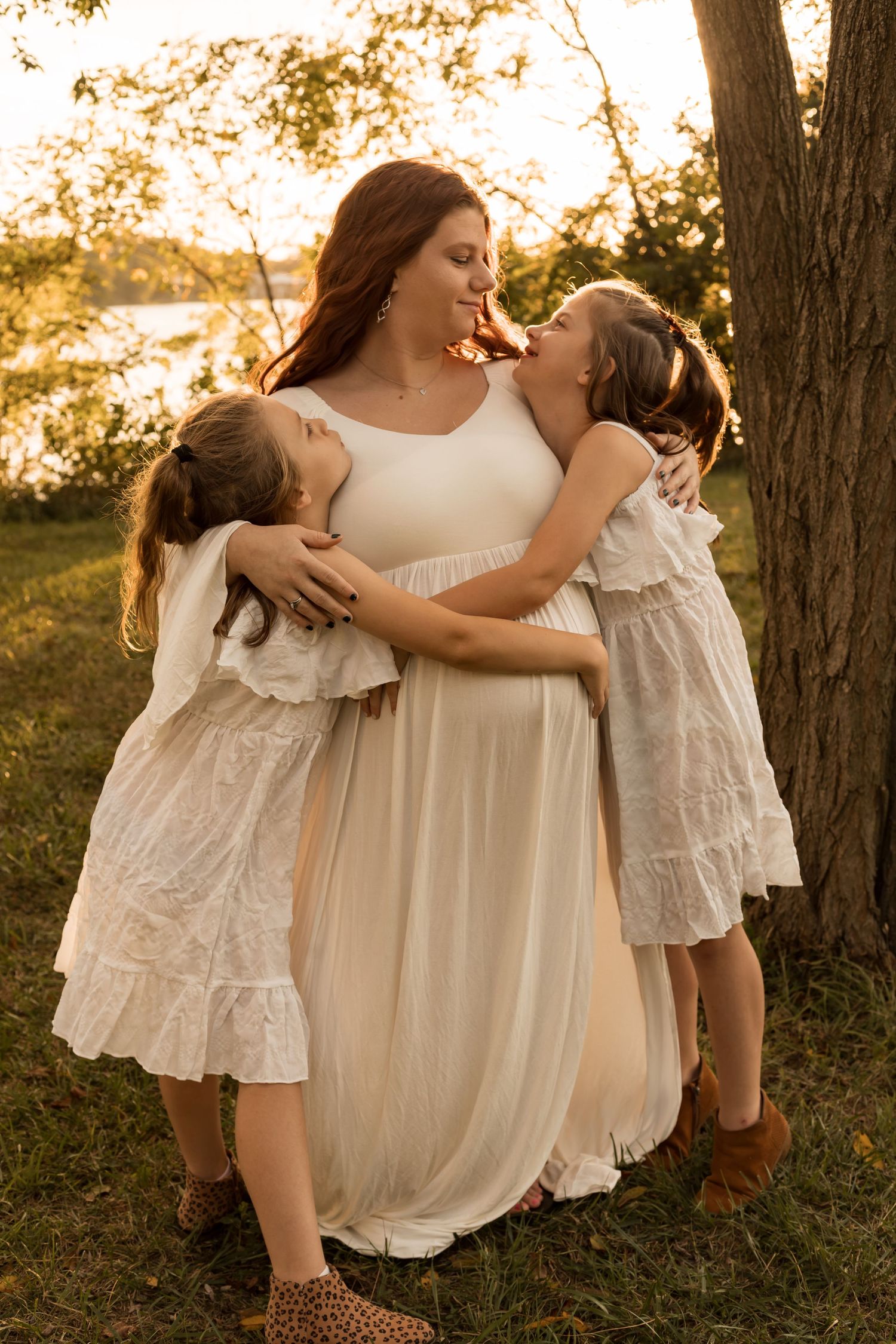 Family with young children enjoying a playful outdoor photography session during golden hour in Maryland.