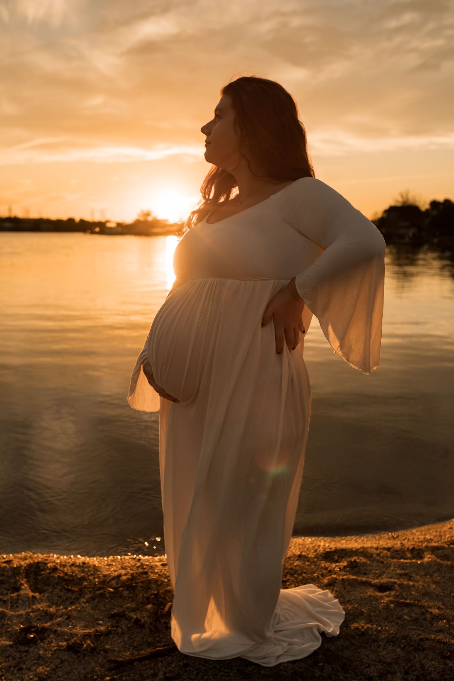 a romantic outdoor maternity photography session at sunset in Maryland.