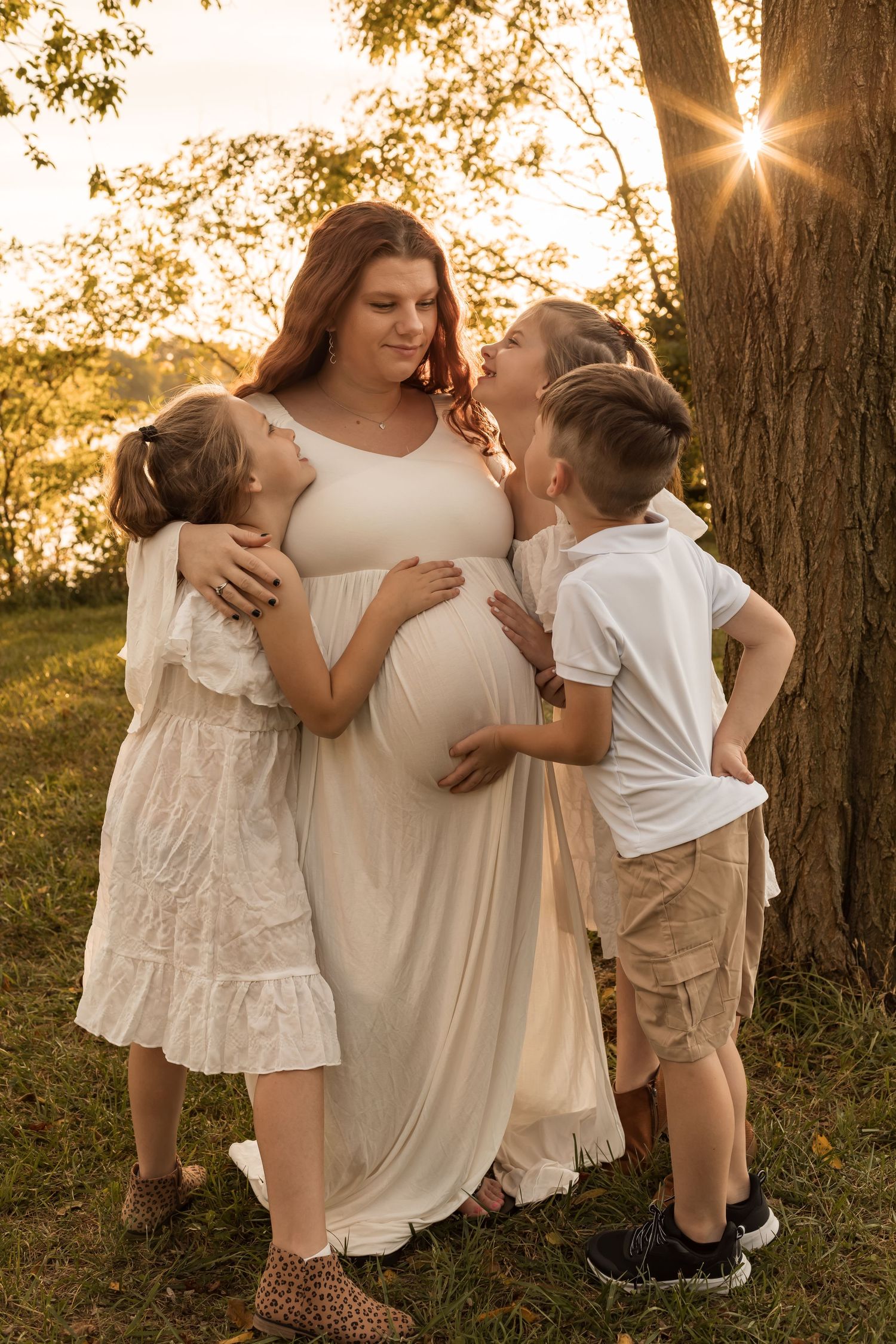 Family with young children enjoying a playful outdoor photography session during golden hour in Maryland.