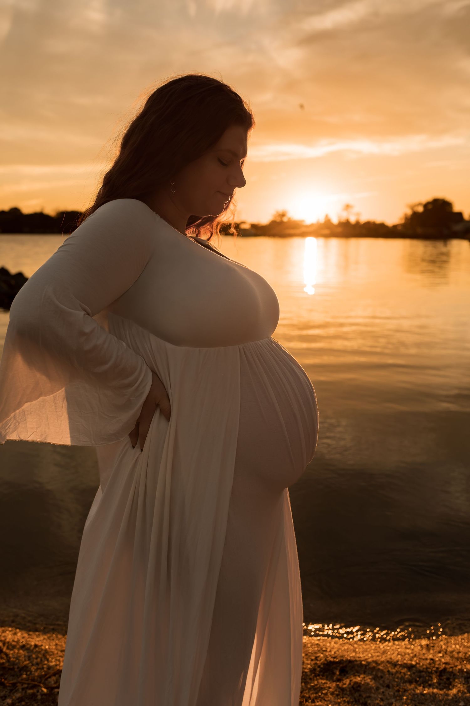 a romantic outdoor maternity photography session at sunset in Maryland.